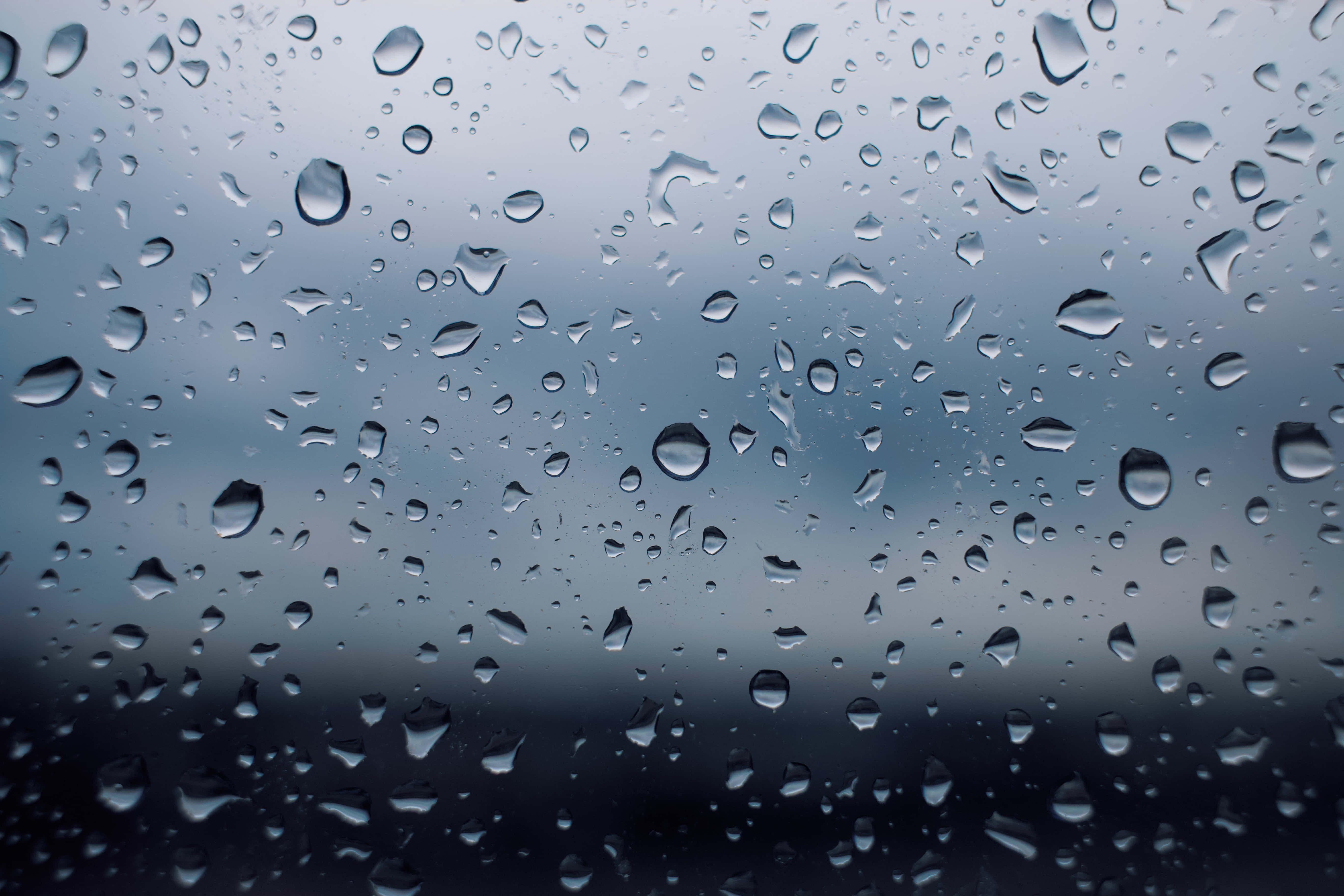 Raindrops, glass surface, gray sky, 5K Desktop Wallpaper