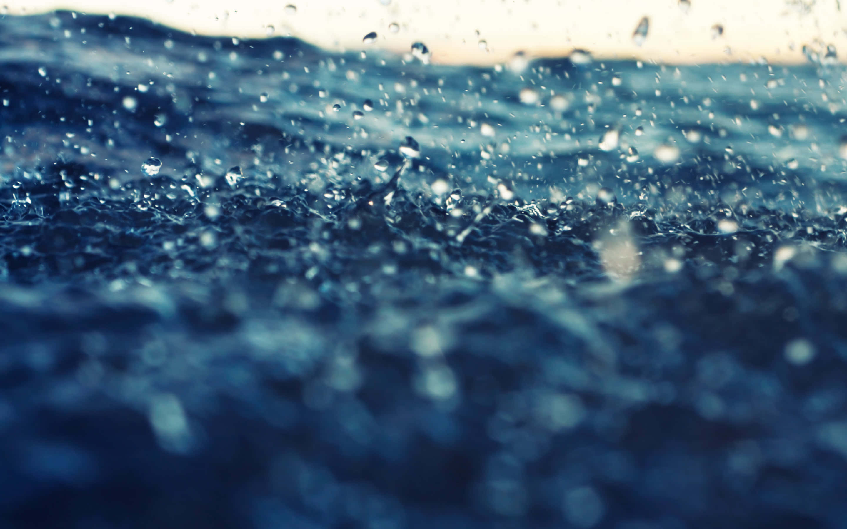 Raindrops, textured ocean waves, sparkling droplets, 2K Desktop Wallpaper