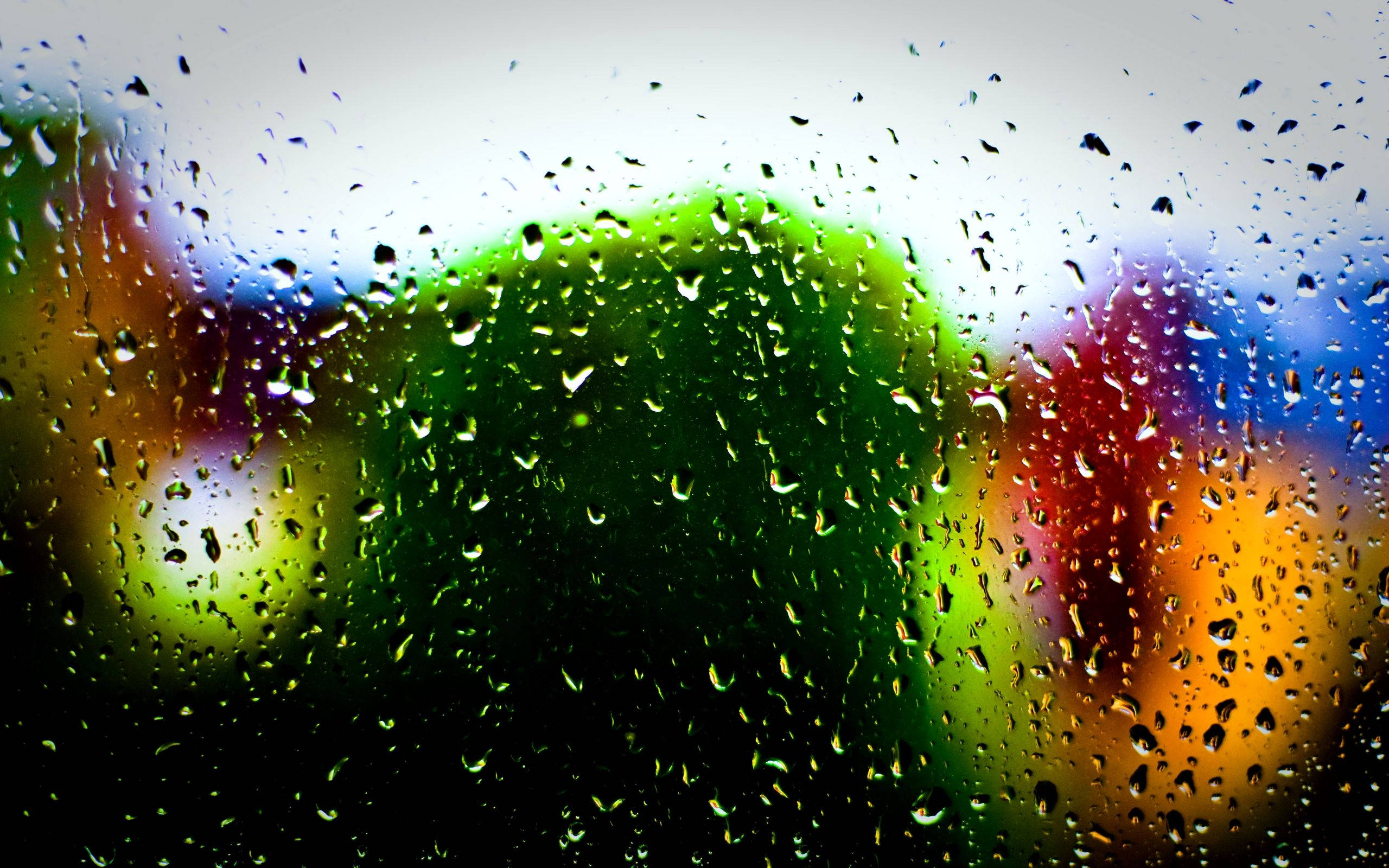 Raindrops, glass surface, multi colored bokeh, 2K Desktop Wallpaper