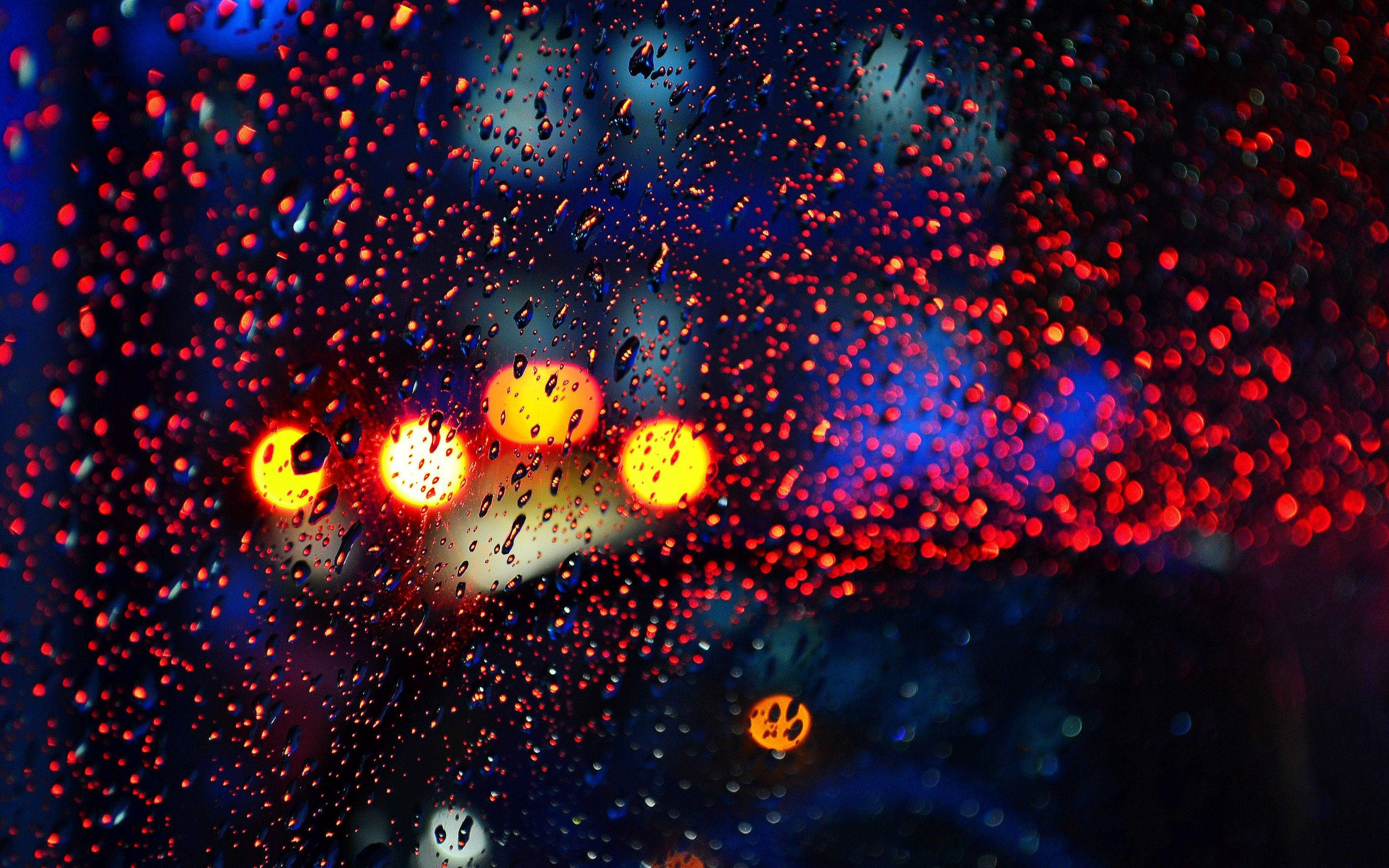 raindrops, colorful bokeh, vibrant red and blue city lights, 2K Desktop Wallpaper
