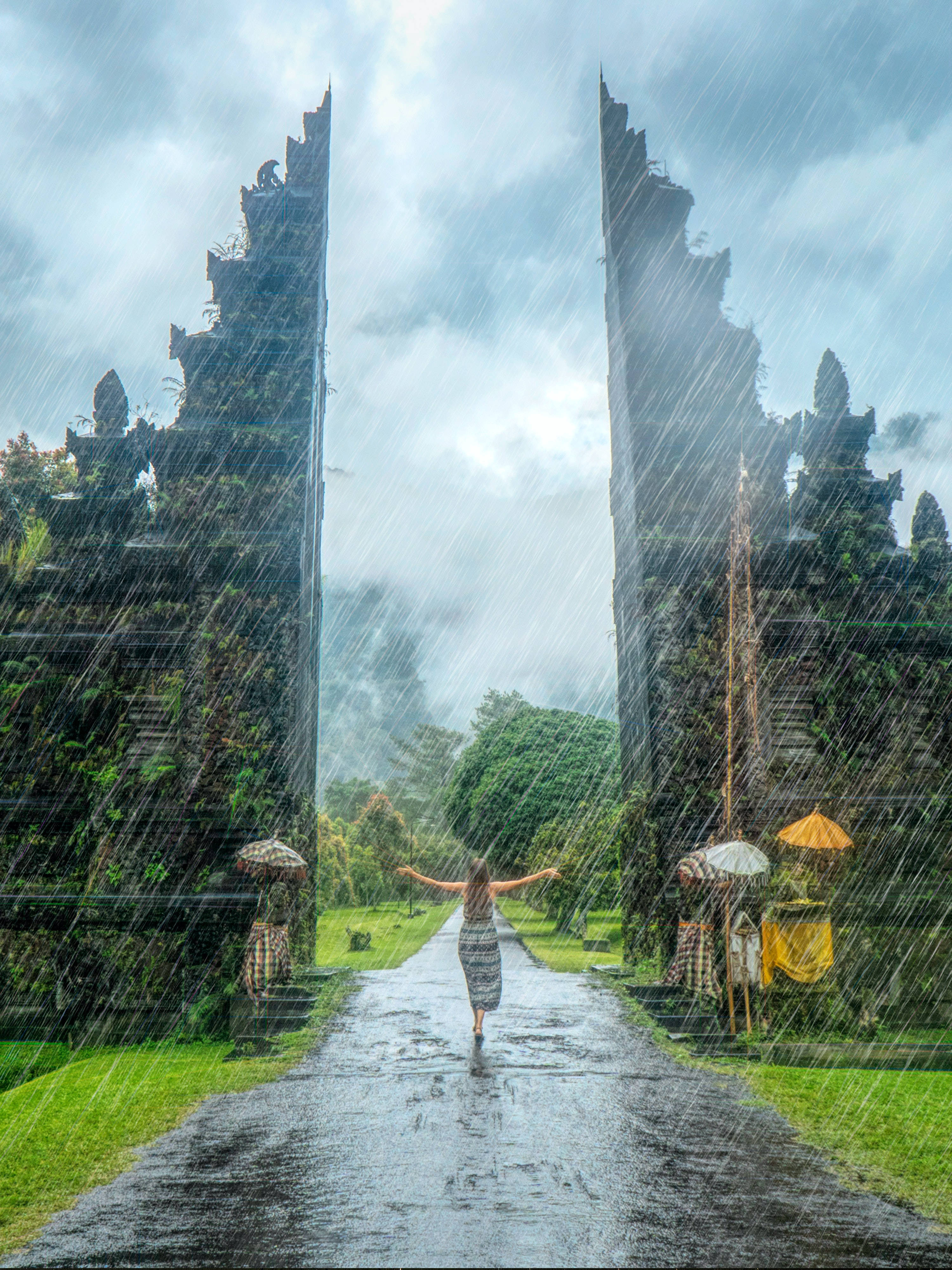 Rain Nature Woman, rain-slicked path, ancient stone gateways, 4K Phone Wallpaper