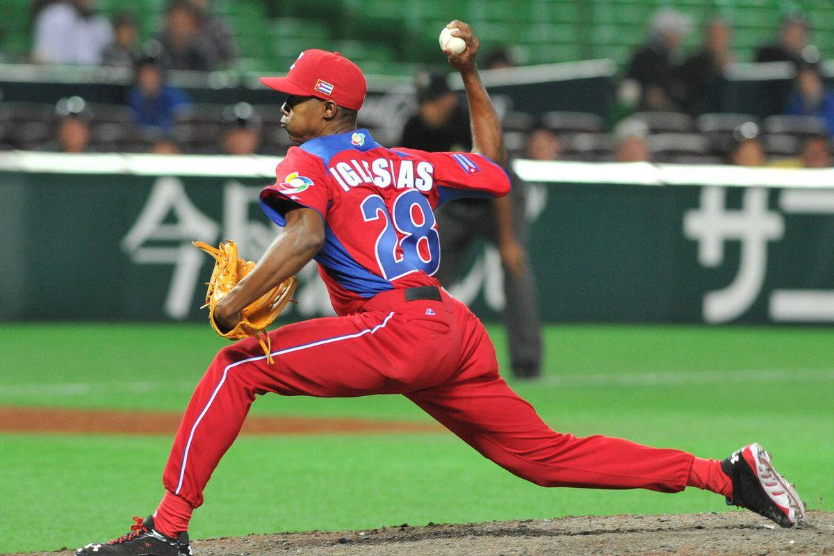 Raisel Iglesias, red uniform, name IGUASAS, SD Desktop Wallpaper