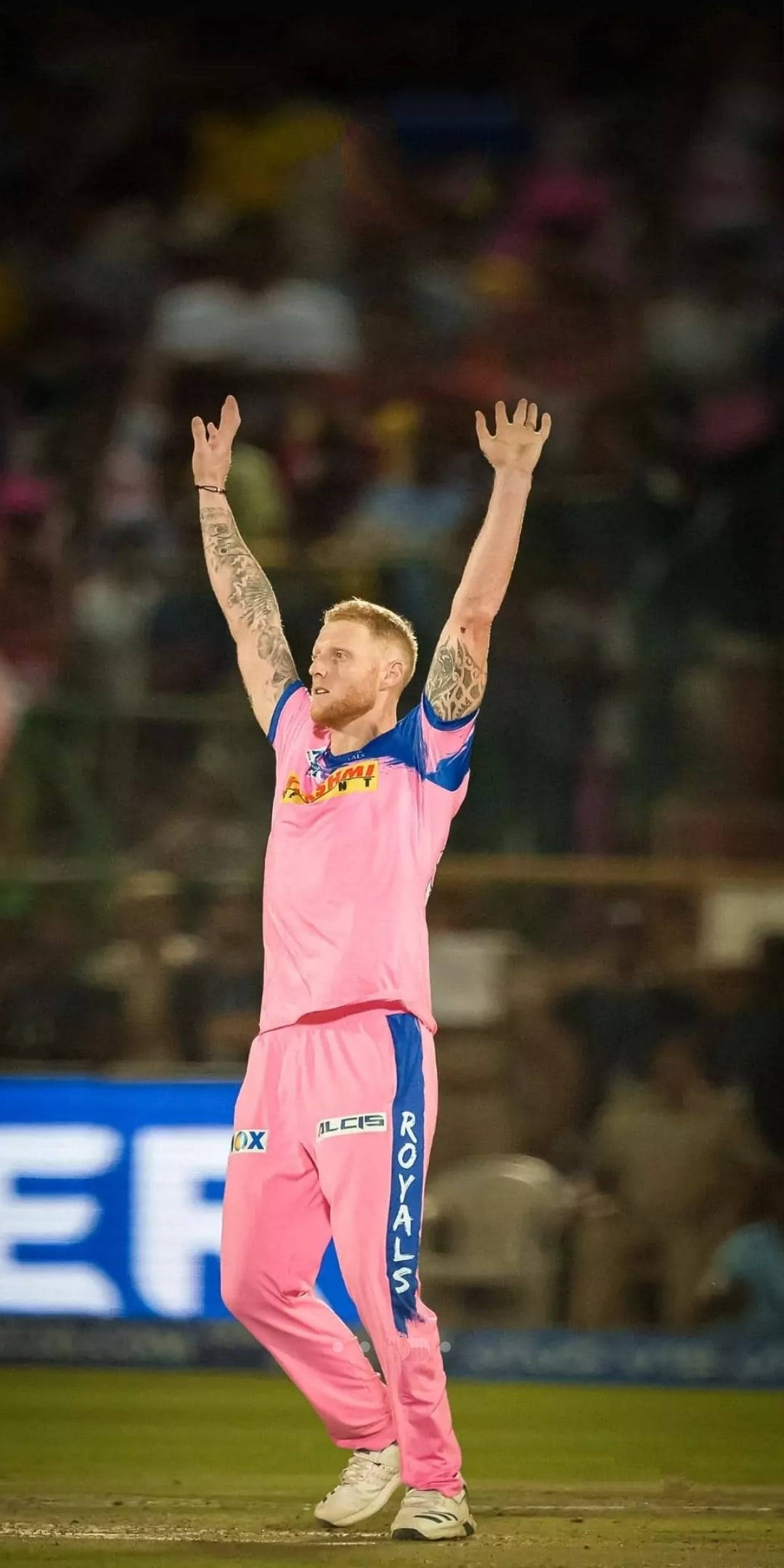 Rajasthan Royals, pink and blue uniform, floodlit stadium field, Full HD Phone Wallpaper