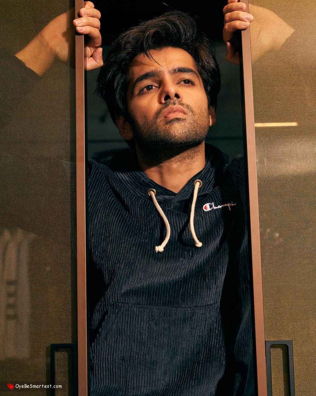 Ram Pothineni, dark corduroy hoodie, glass door frame, HD Phone Wallpaper