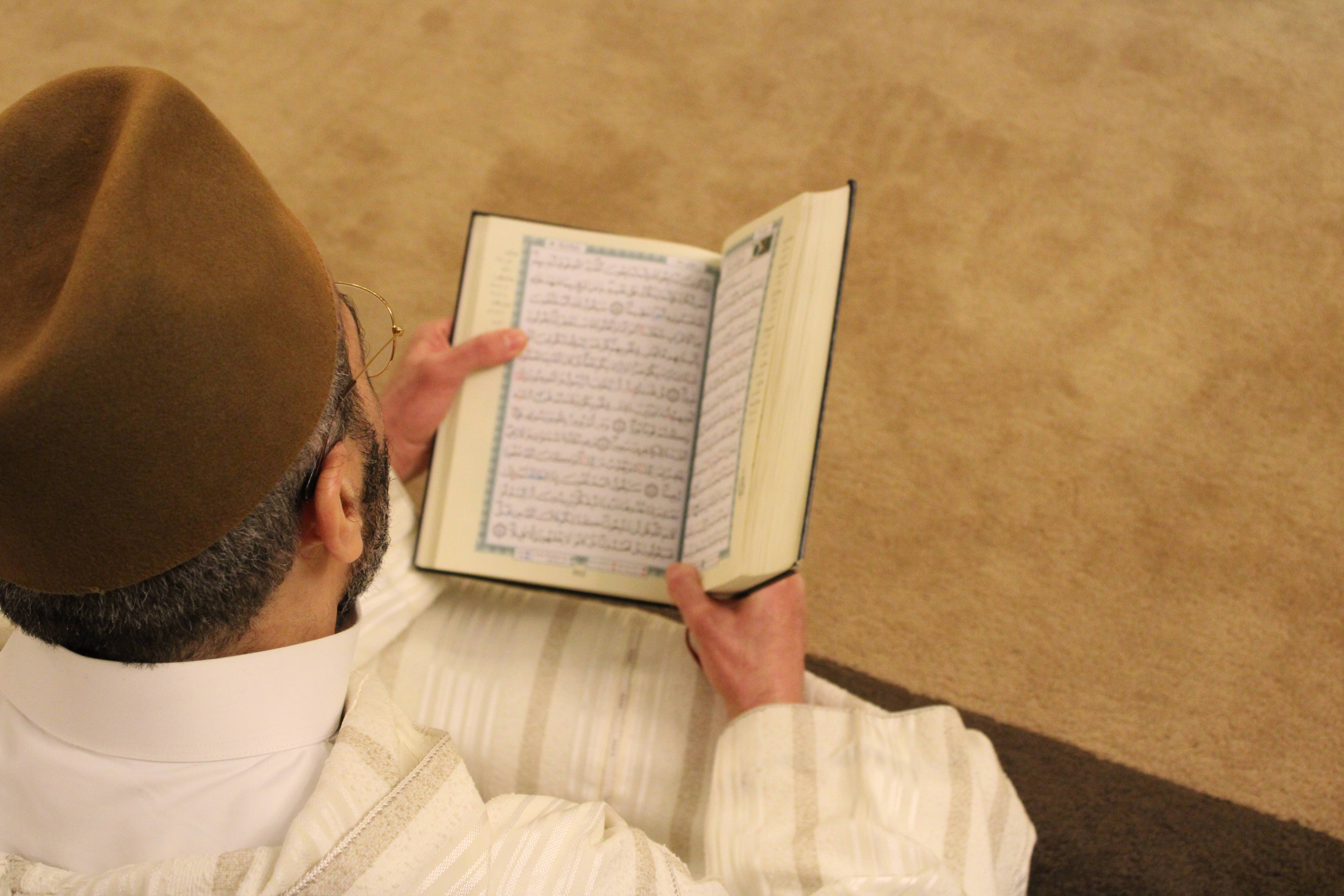Quranic book, brown cap, glasses, 5K Desktop Wallpaper