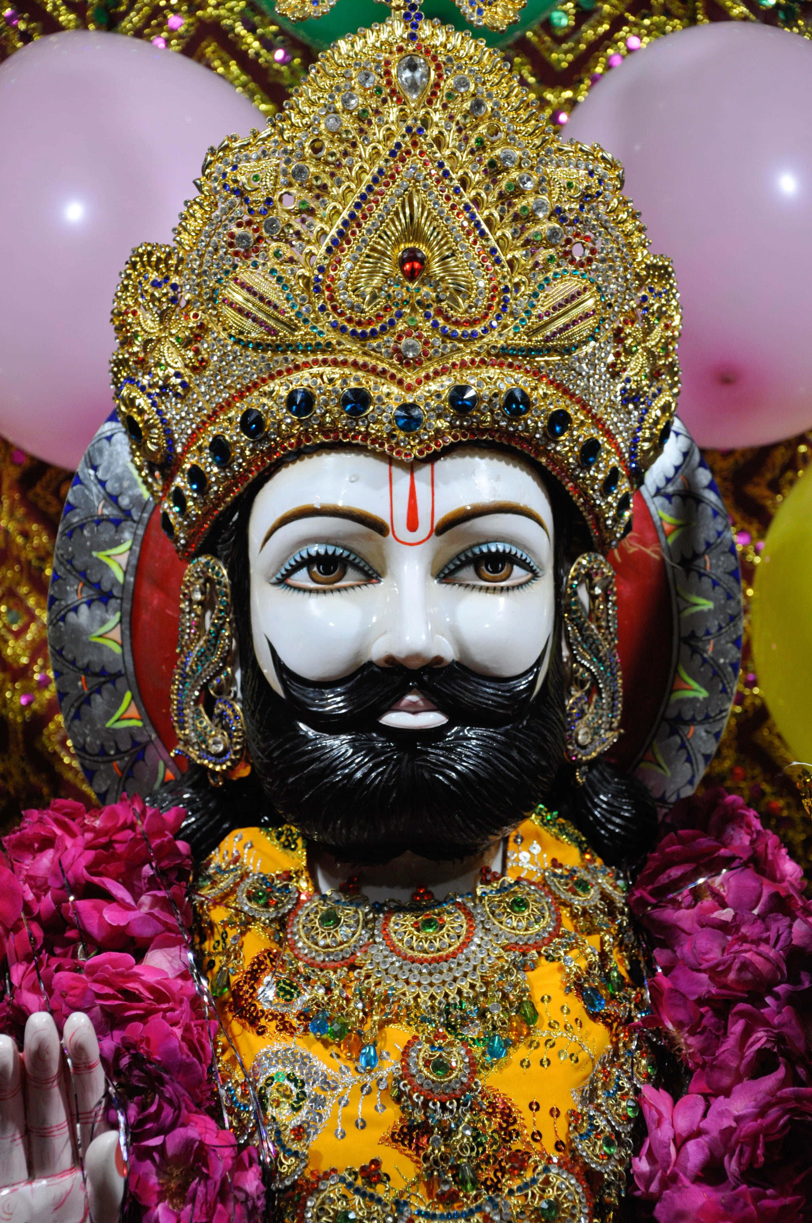 Ramapir, golden deity statue, black beard, 4K Phone Wallpaper