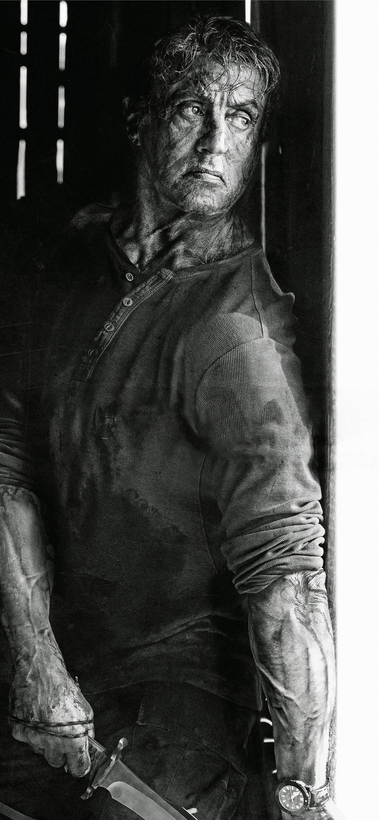 Rambo, knife, dimly lit doorway, 2K Phone Wallpaper