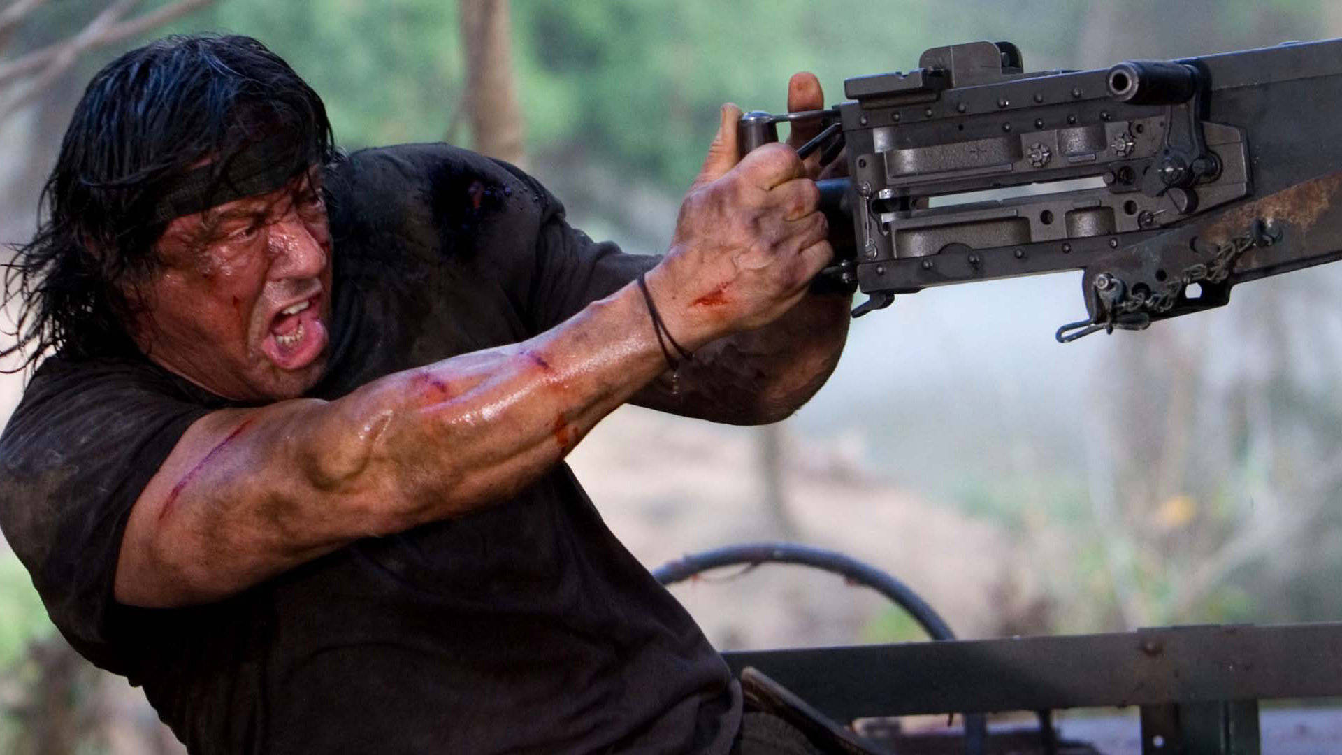 Rambo, heavy machine gun, muddy outdoor setting, Full HD Desktop Wallpaper