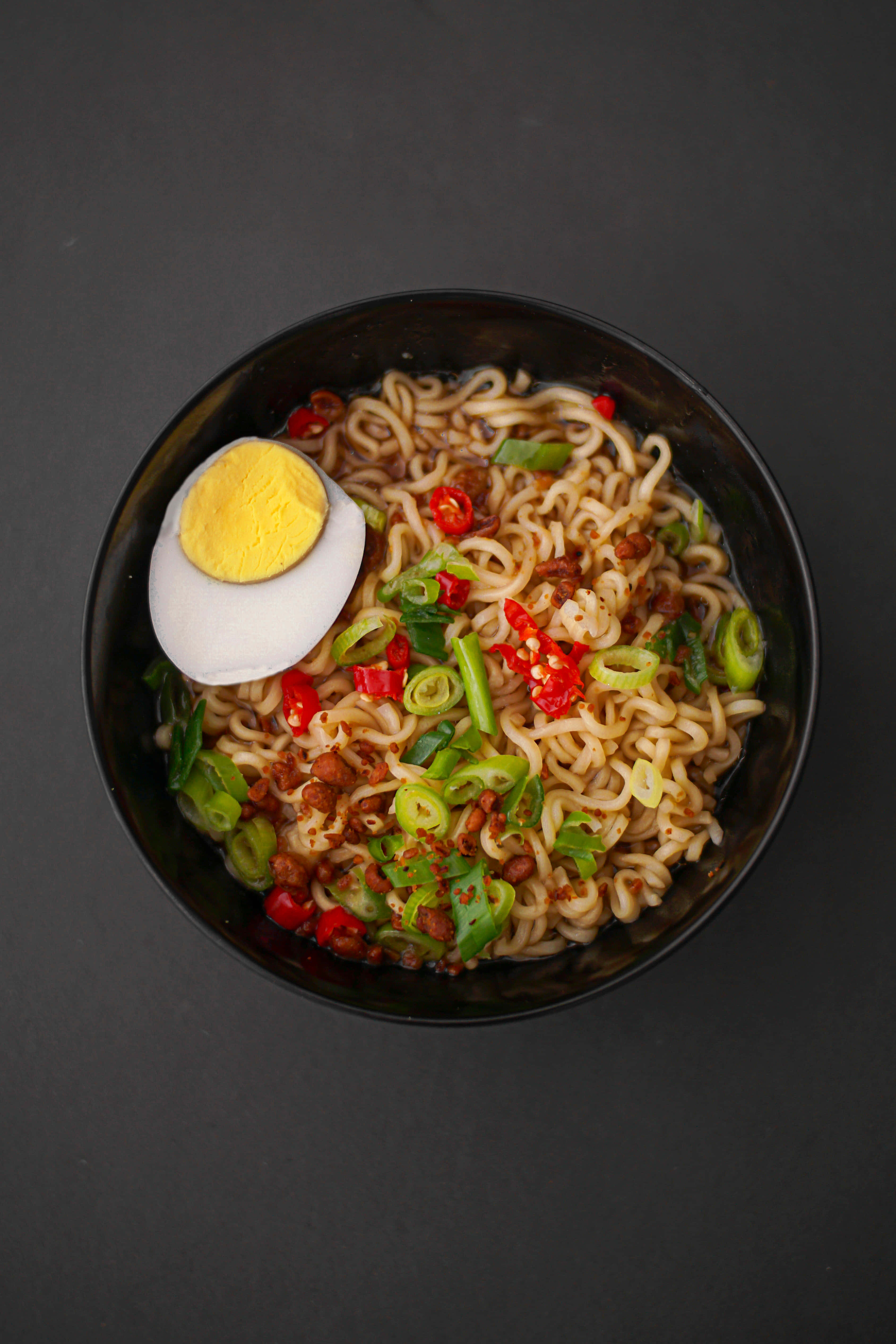 spicy ramen, steaming bowl, halved boiled egg, 4K Phone Wallpaper