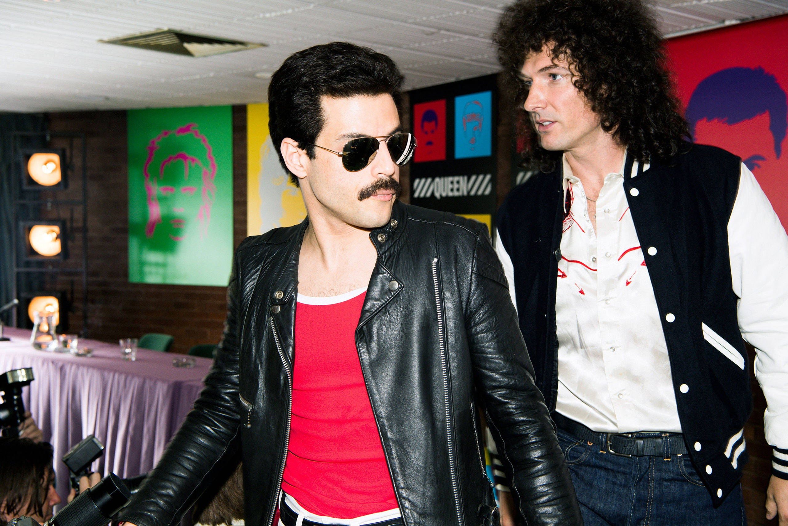 70s rock attire, colorful pop art posters, themed event, 2K Desktop Wallpaper