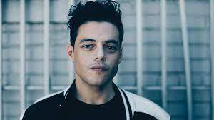 Rami Malek, cool blue lighting, blurred vertical-bar background, SD Desktop Wallpaper