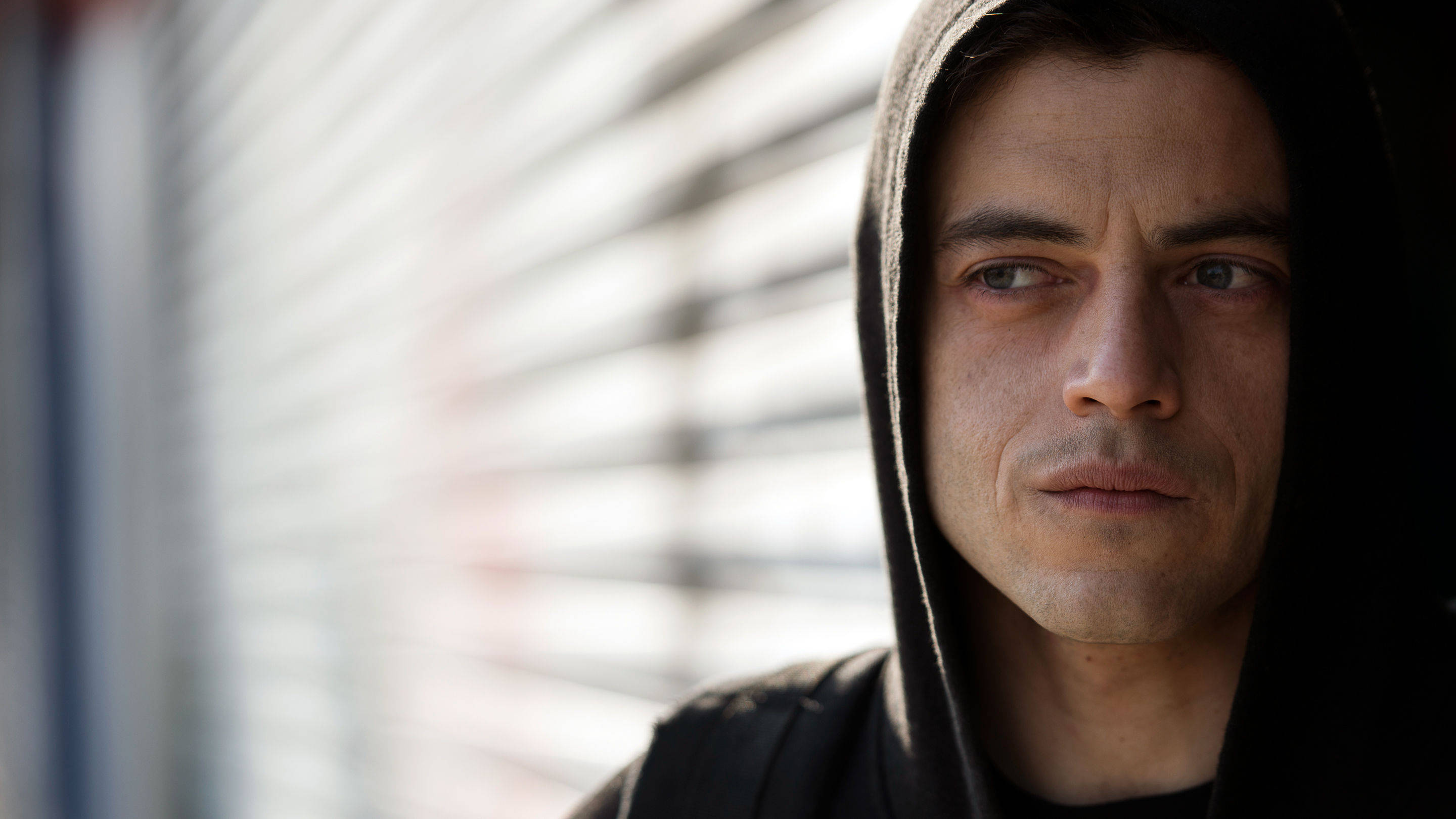 Rami Malek, black hoodie, blurred background, 2K Desktop Wallpaper