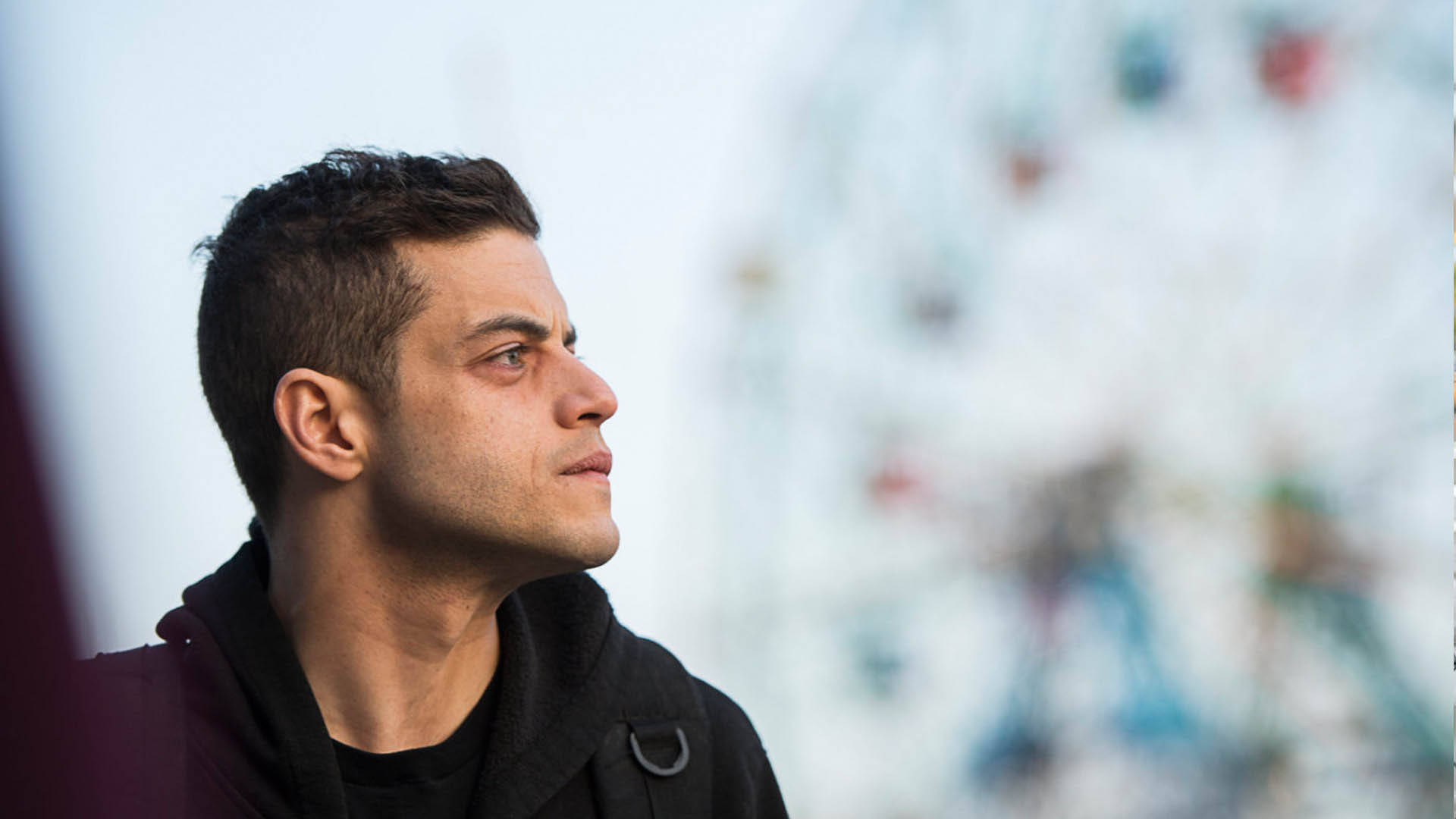 Rami Malek, black hoodie, gazes thoughtfully upward, Full HD Desktop Wallpaper