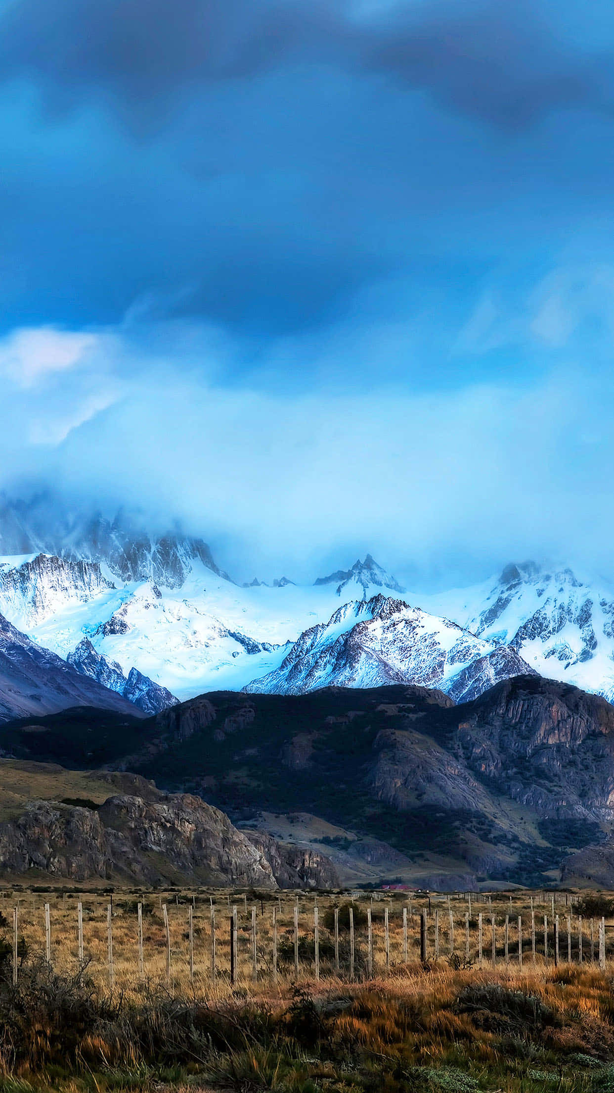 ranch, snowcapped mountain peaks, dramatic blue clouds, Full HD Phone Wallpaper
