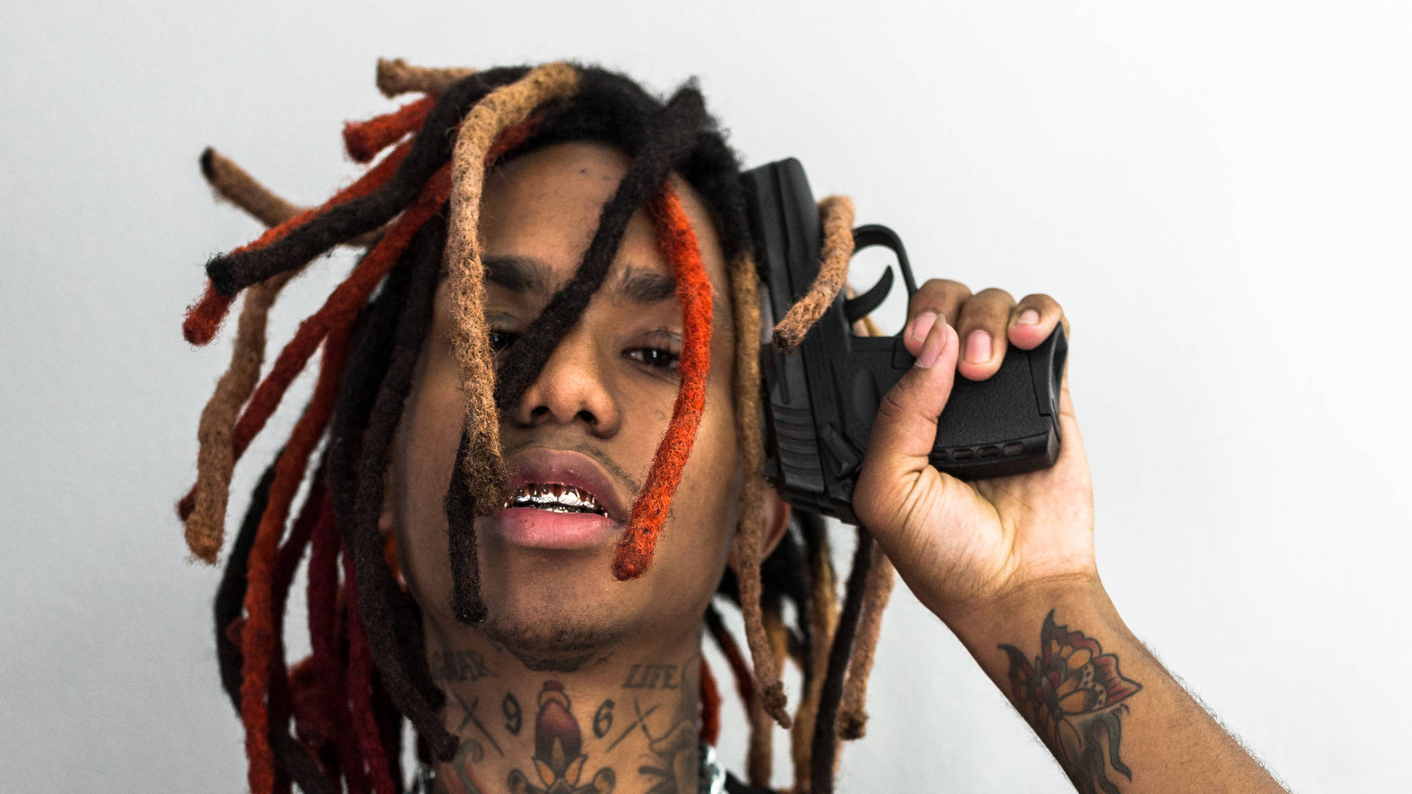 red and brown dreadlocks, black handgun, plain white background, Full HD Desktop Wallpaper