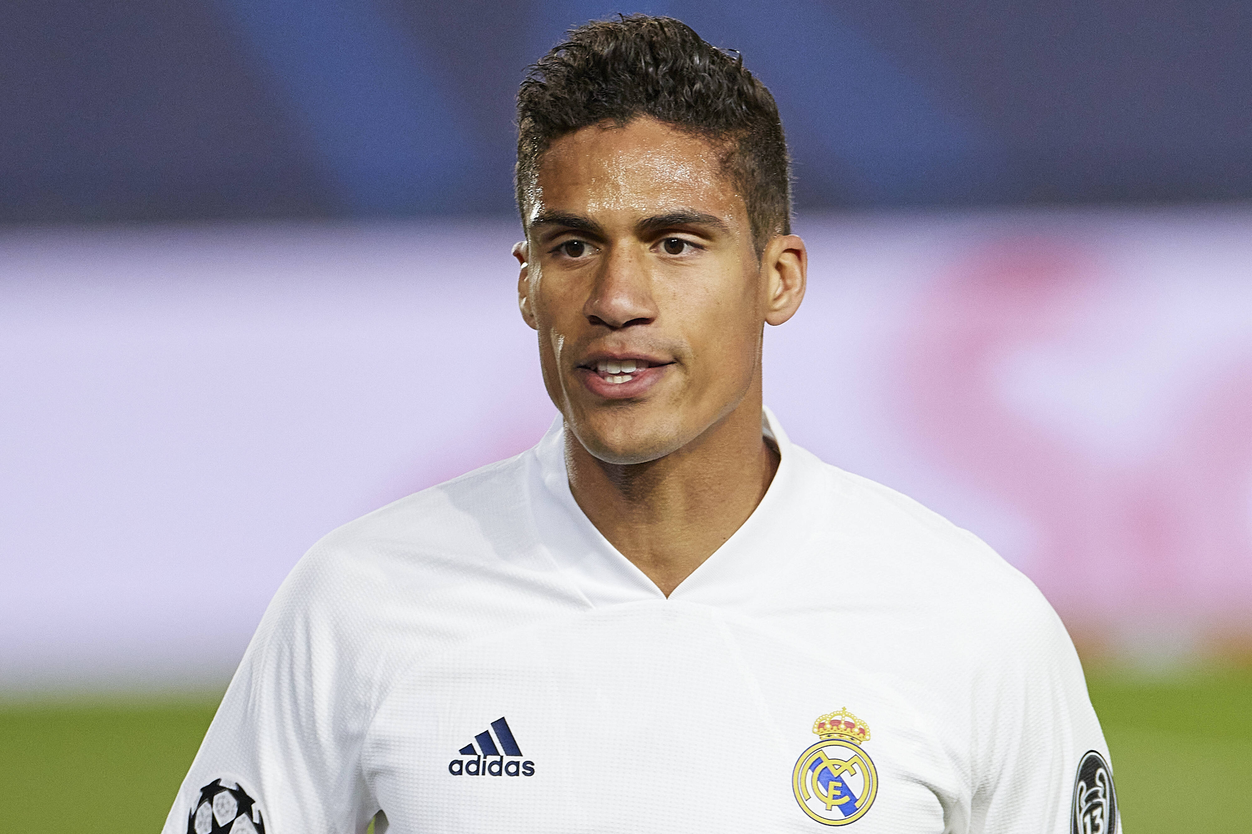 Raphael Varane, white Real Madrid jersey, vibrant green pitch, 4K Desktop Wallpaper