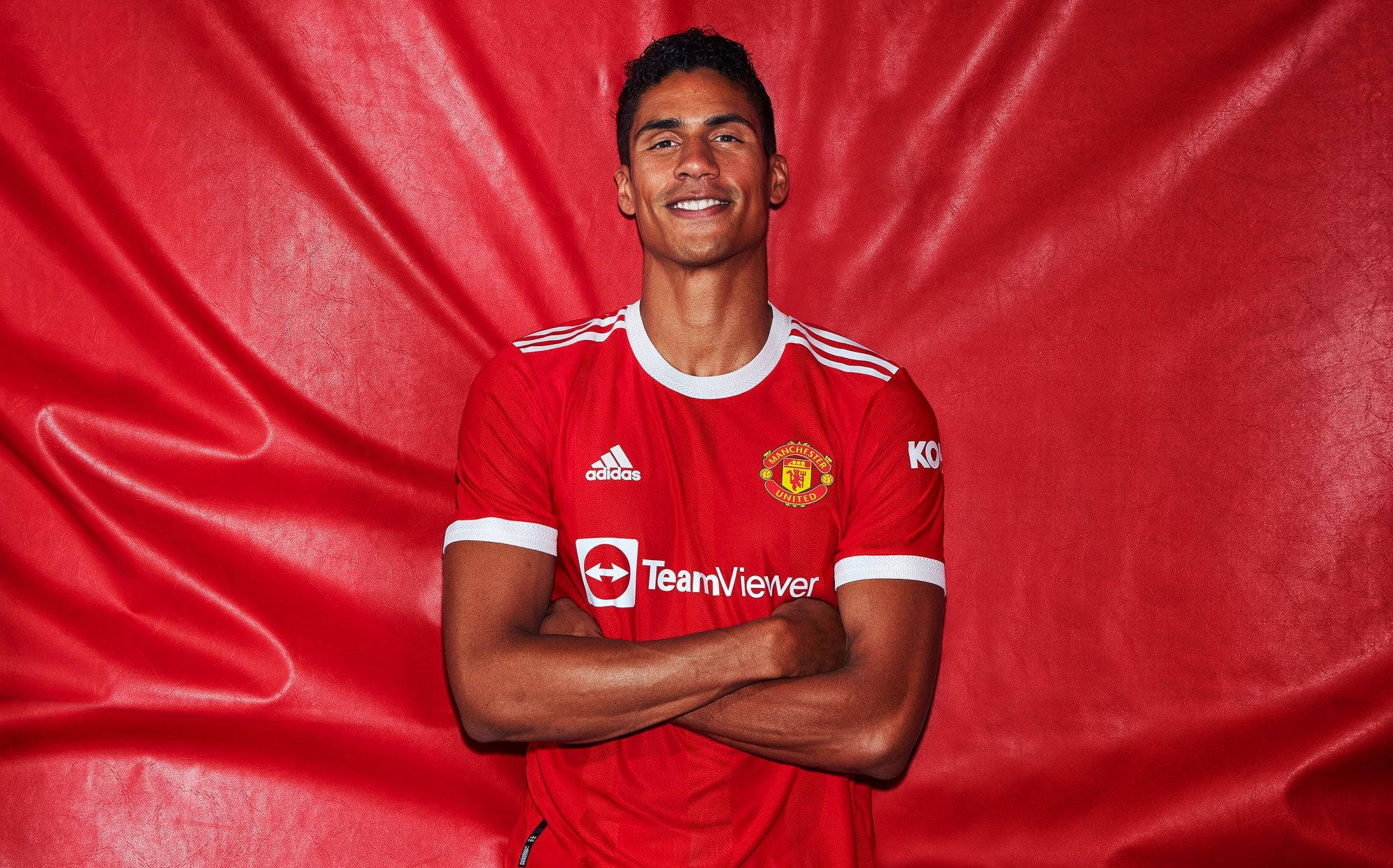 Raphael Varane, red Manchester United jersey, red backdrop, Full HD Desktop Wallpaper