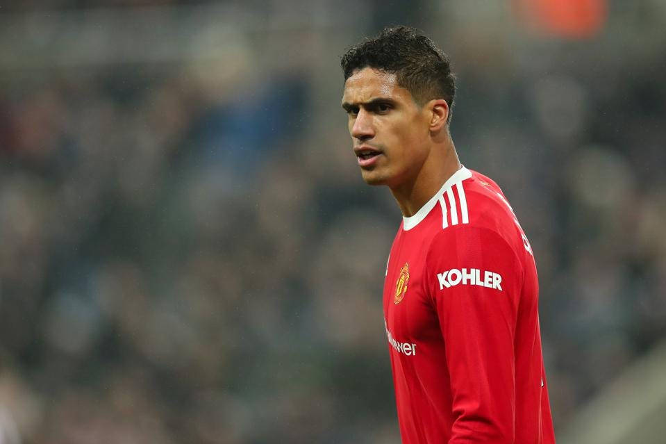 Raphael Varane, red Manchester United jersey, stadium field, SD Desktop Wallpaper