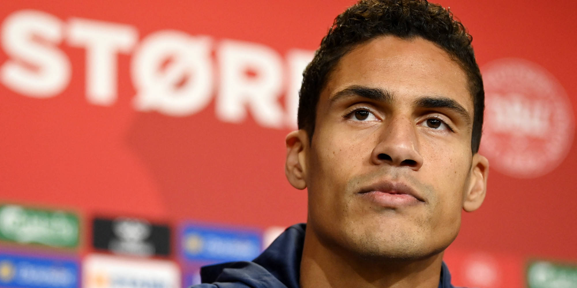 Raphael Varane, vibrant red backdrop, white logos, Full HD Desktop Wallpaper