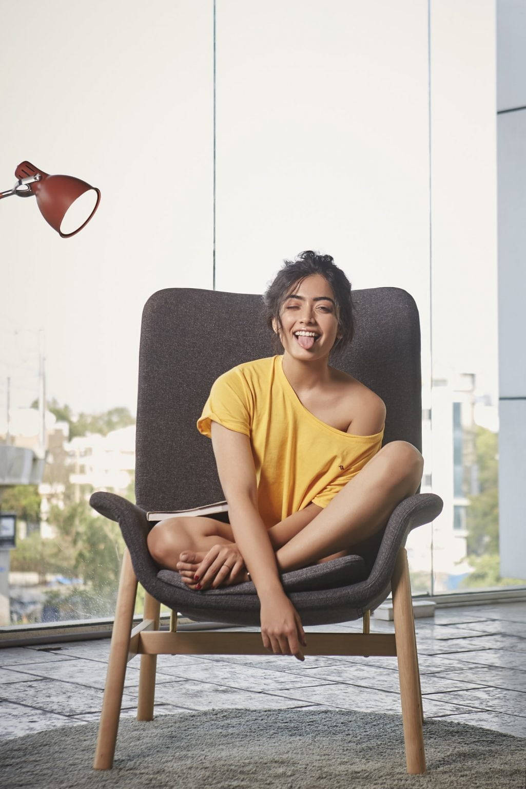 Rashmika Mandanna, yellow top, modern armchair, HD Phone Wallpaper