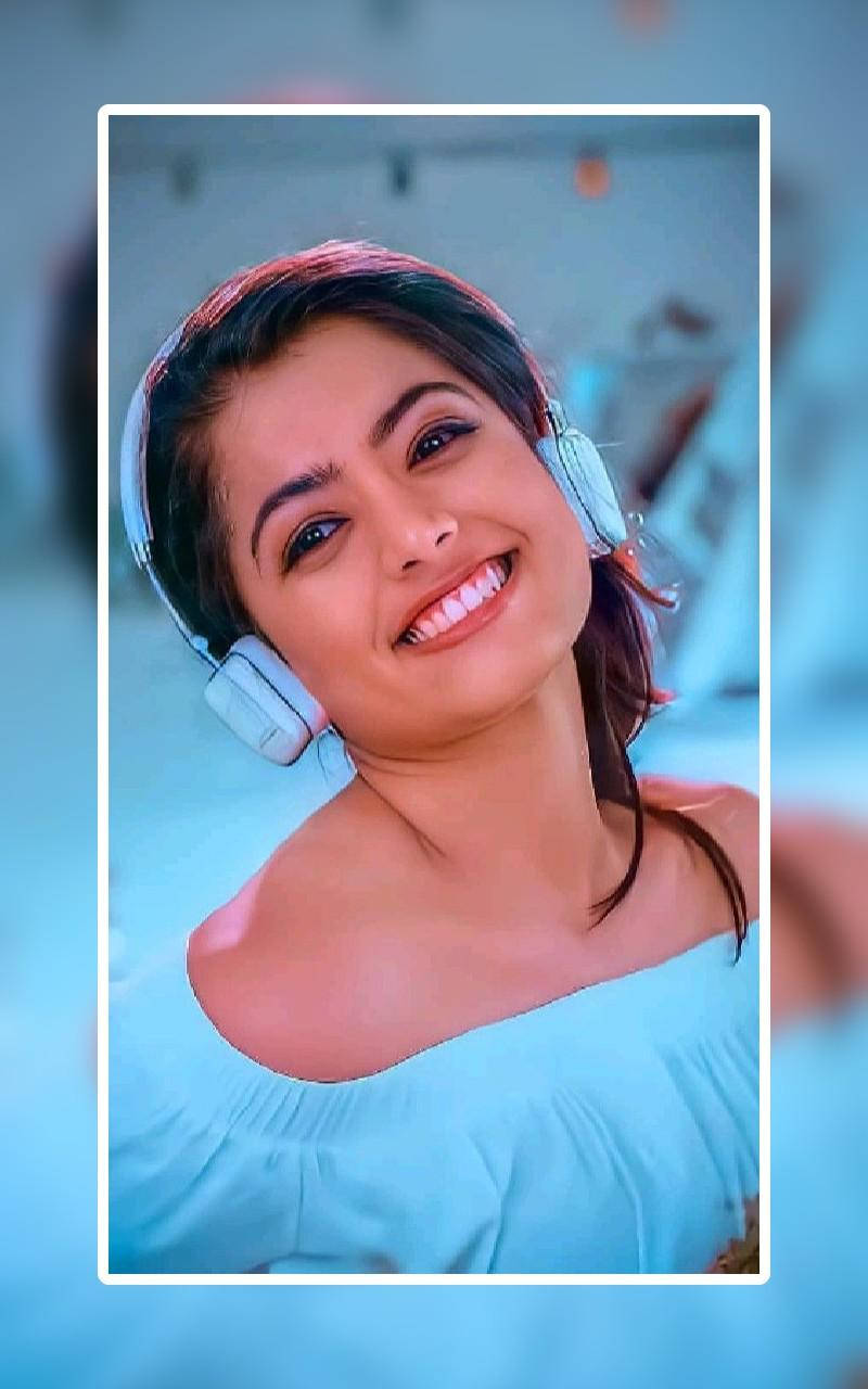 Rashmika Mandanna, light blue over-ear headphones, soft blurred background, HD Phone Wallpaper