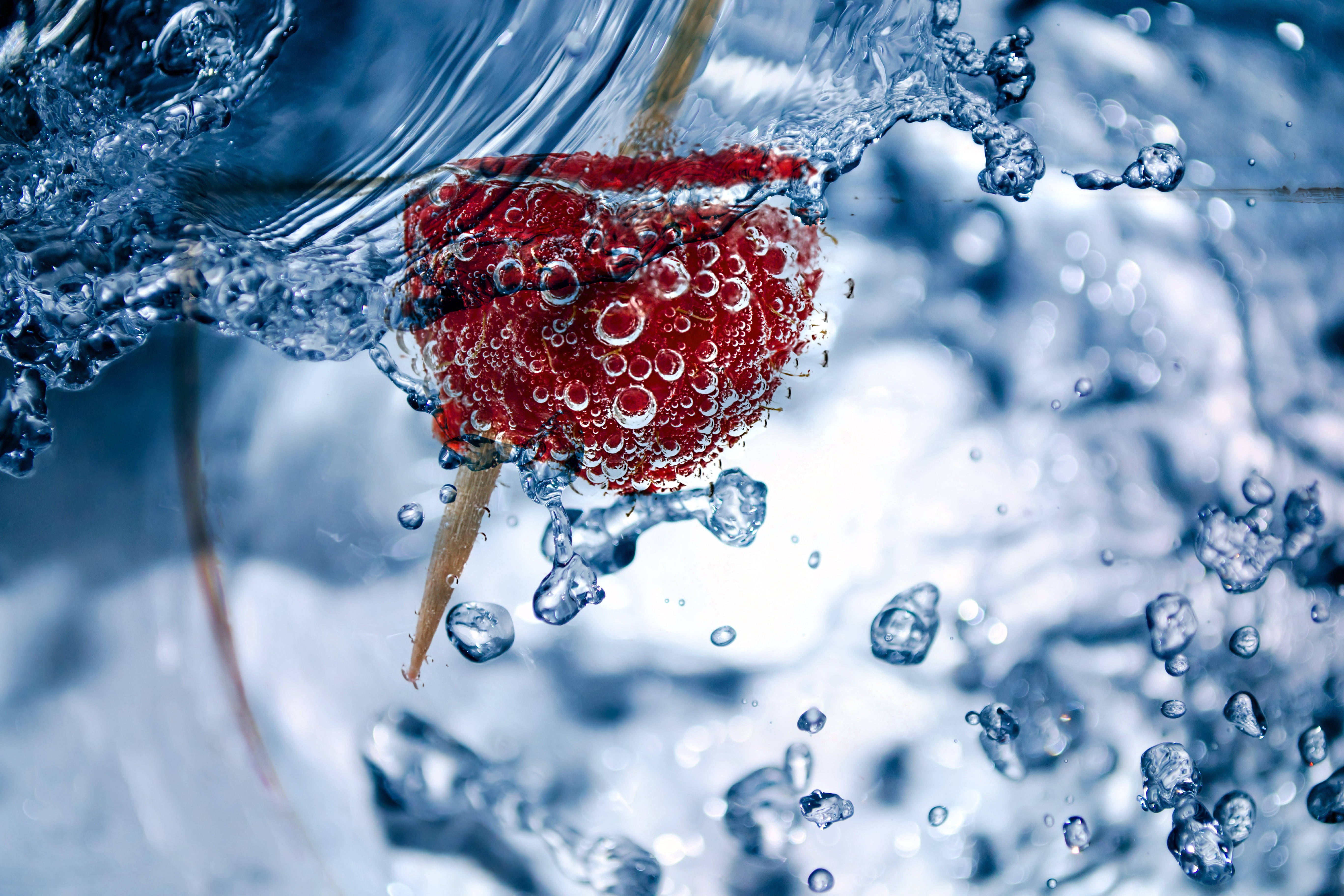 Raspberry In Liquid, vibrant red, clear blue water, 5K Desktop Wallpaper