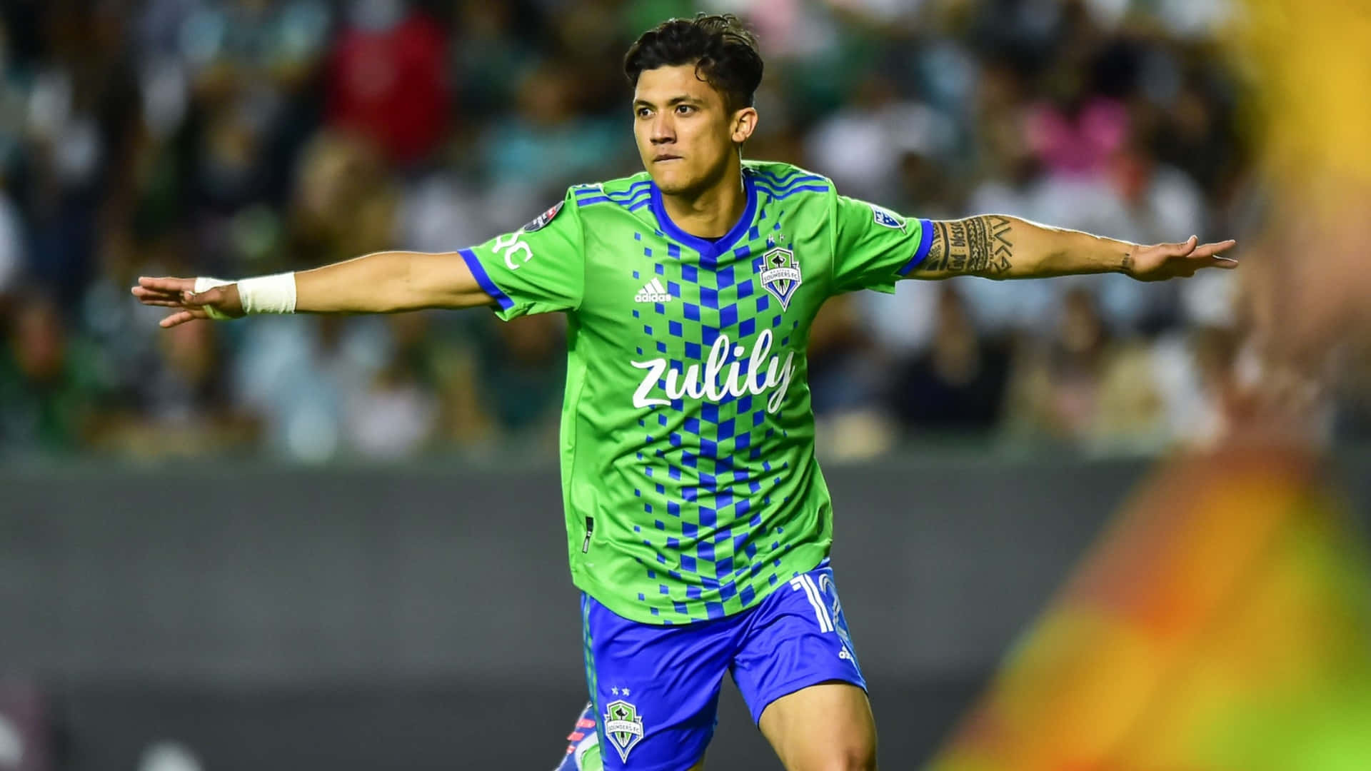 Raul Ruidiaz, vibrant green and blue jersey, stadium field, Full HD Desktop Wallpaper