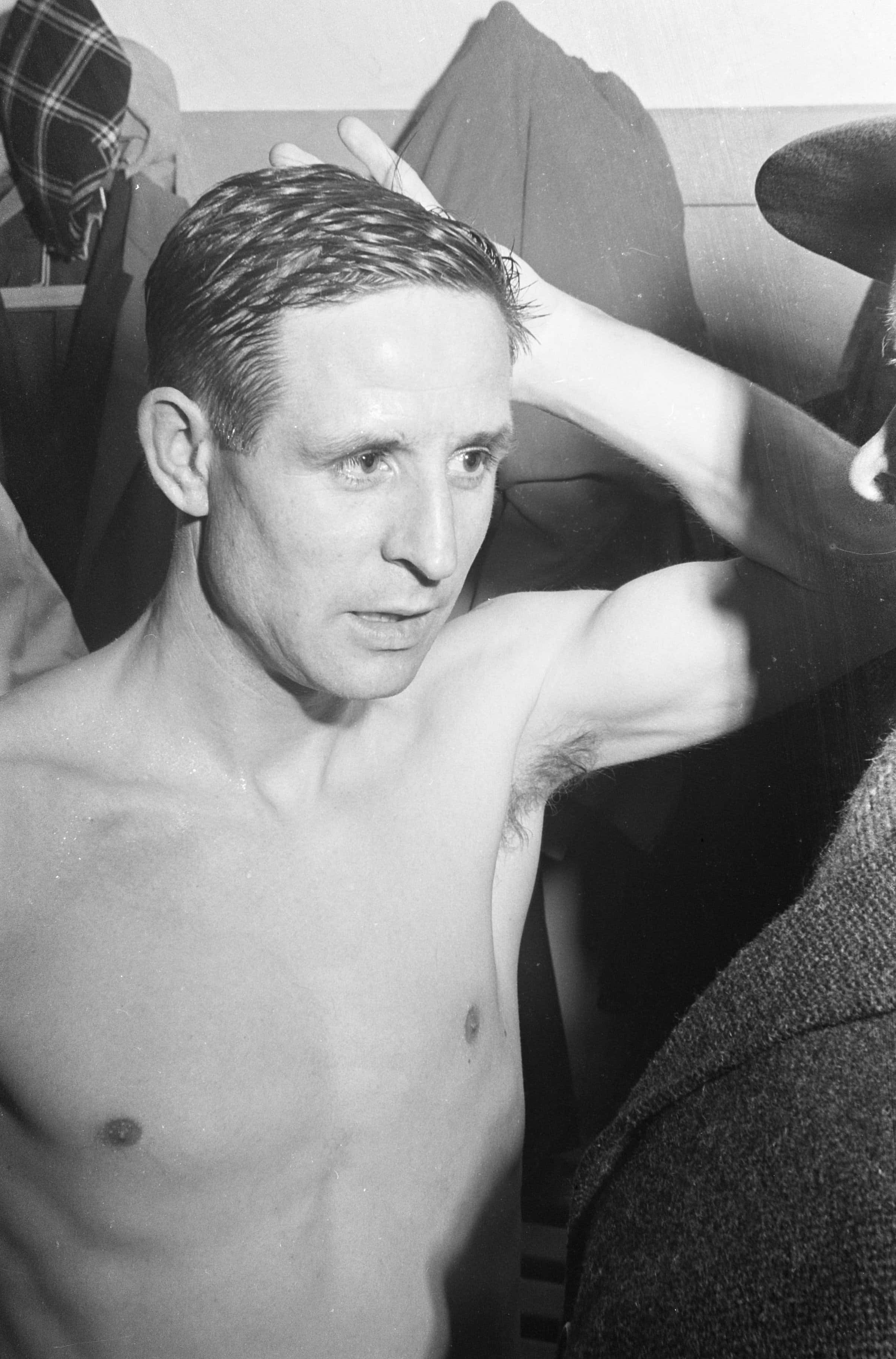 Raymond Kopa, post game moment, dimly lit room, 2K Phone Wallpaper