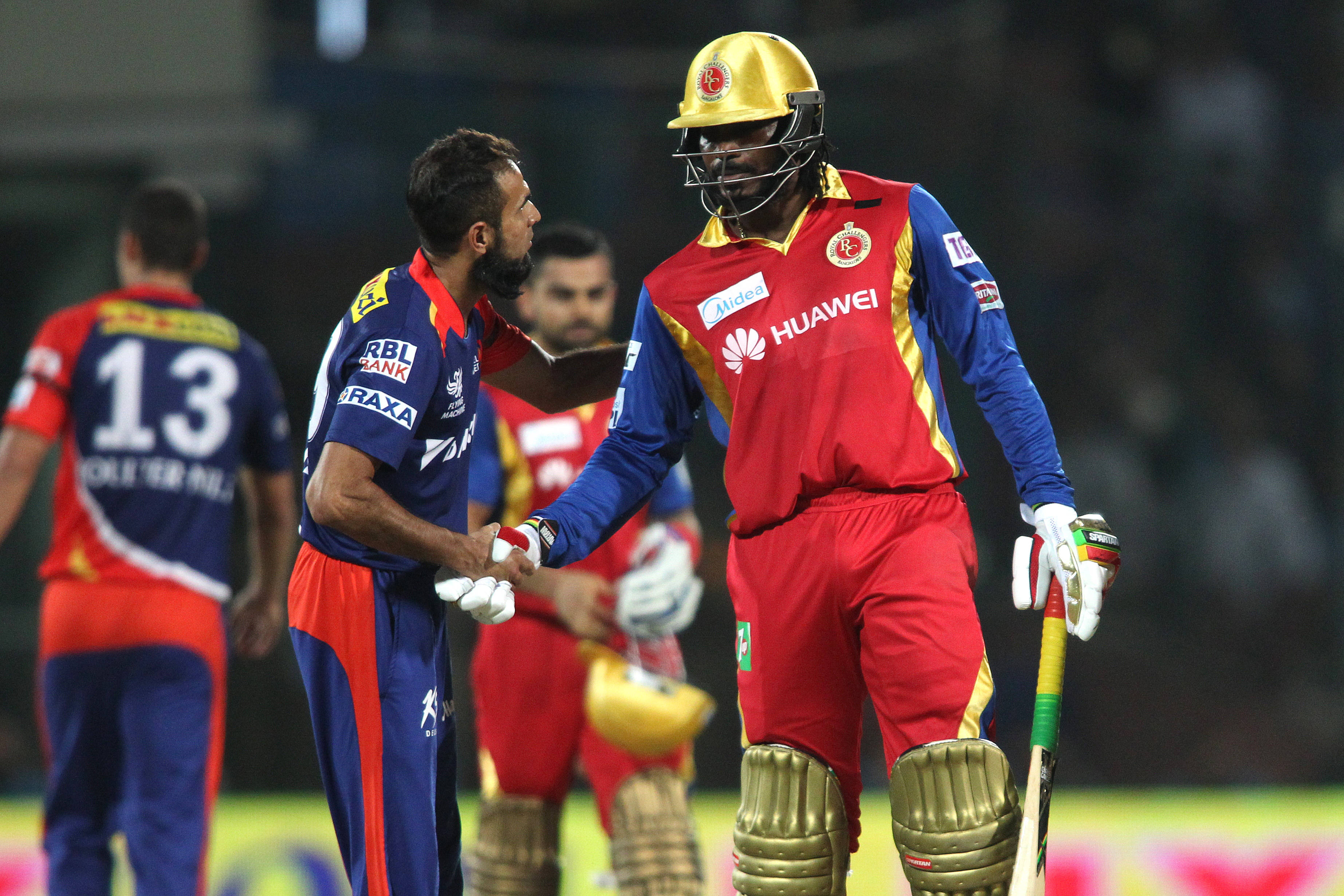 RCB Team, cricket players, vibrant uniforms, 2K Desktop Wallpaper