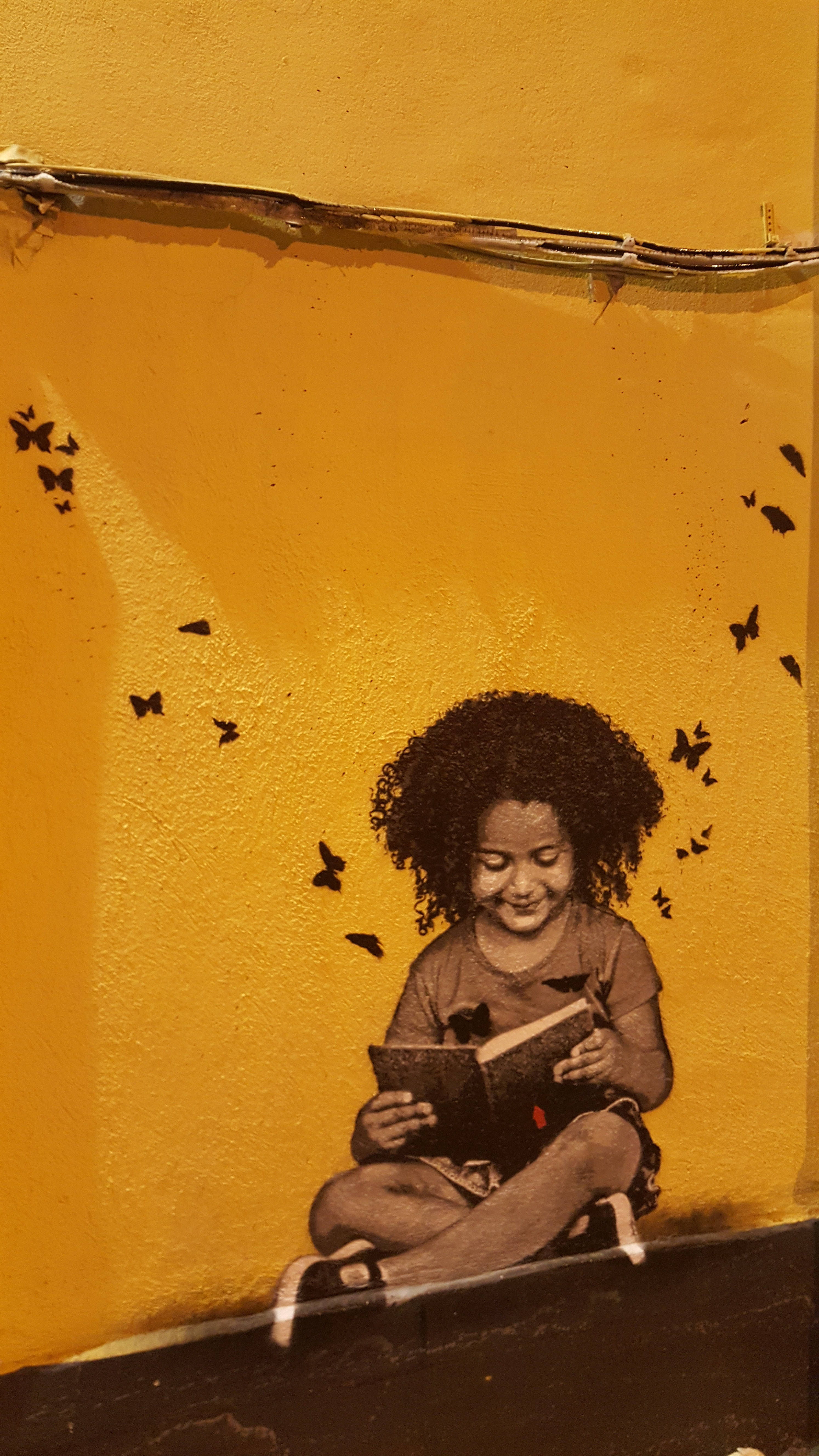 bookworm kid, black butterflies, vibrant yellow wall, 5K Phone Wallpaper
