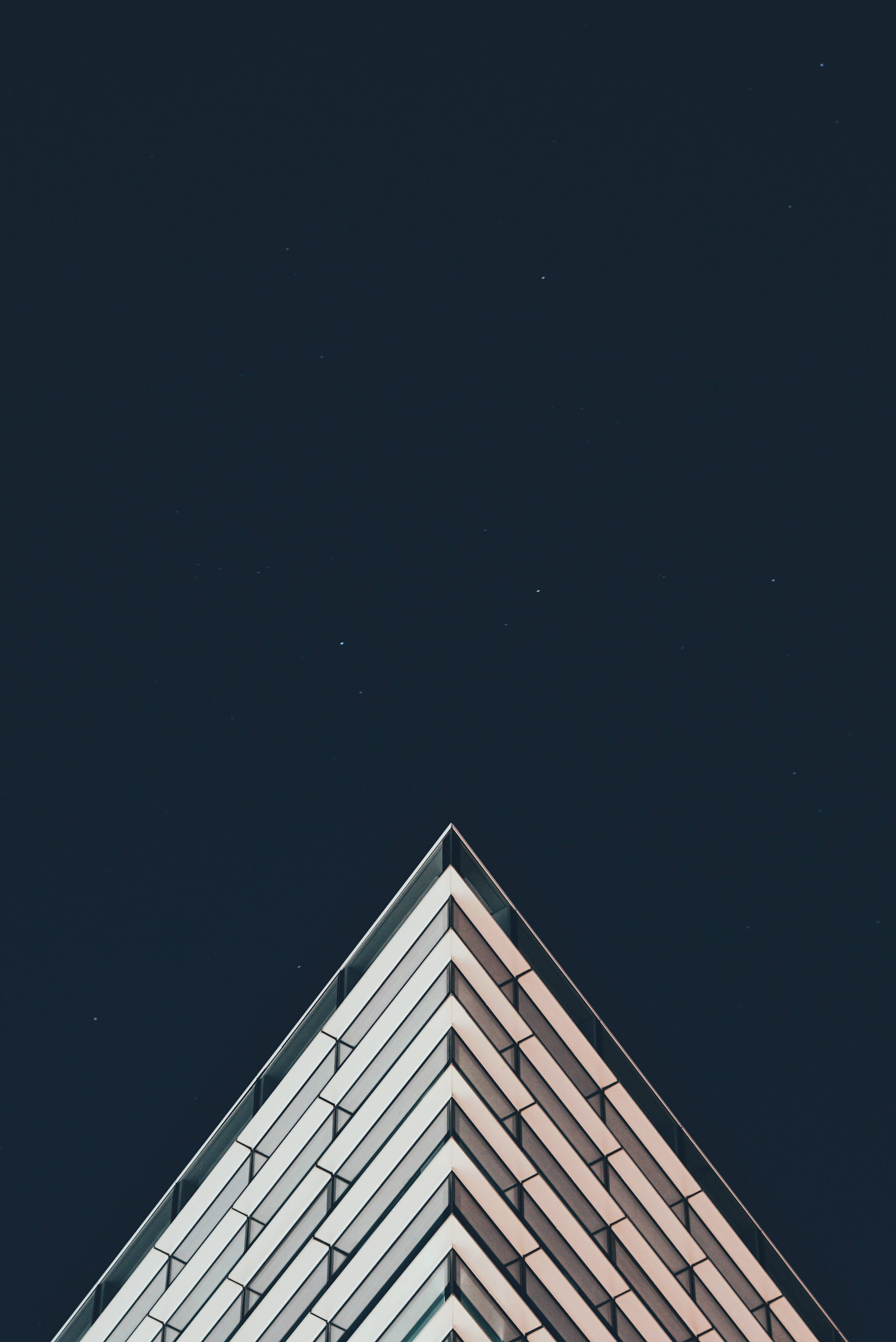 minimal building corner architecture, geometric rooftop angles, starry midnight sky, 4K Phone Wallpaper