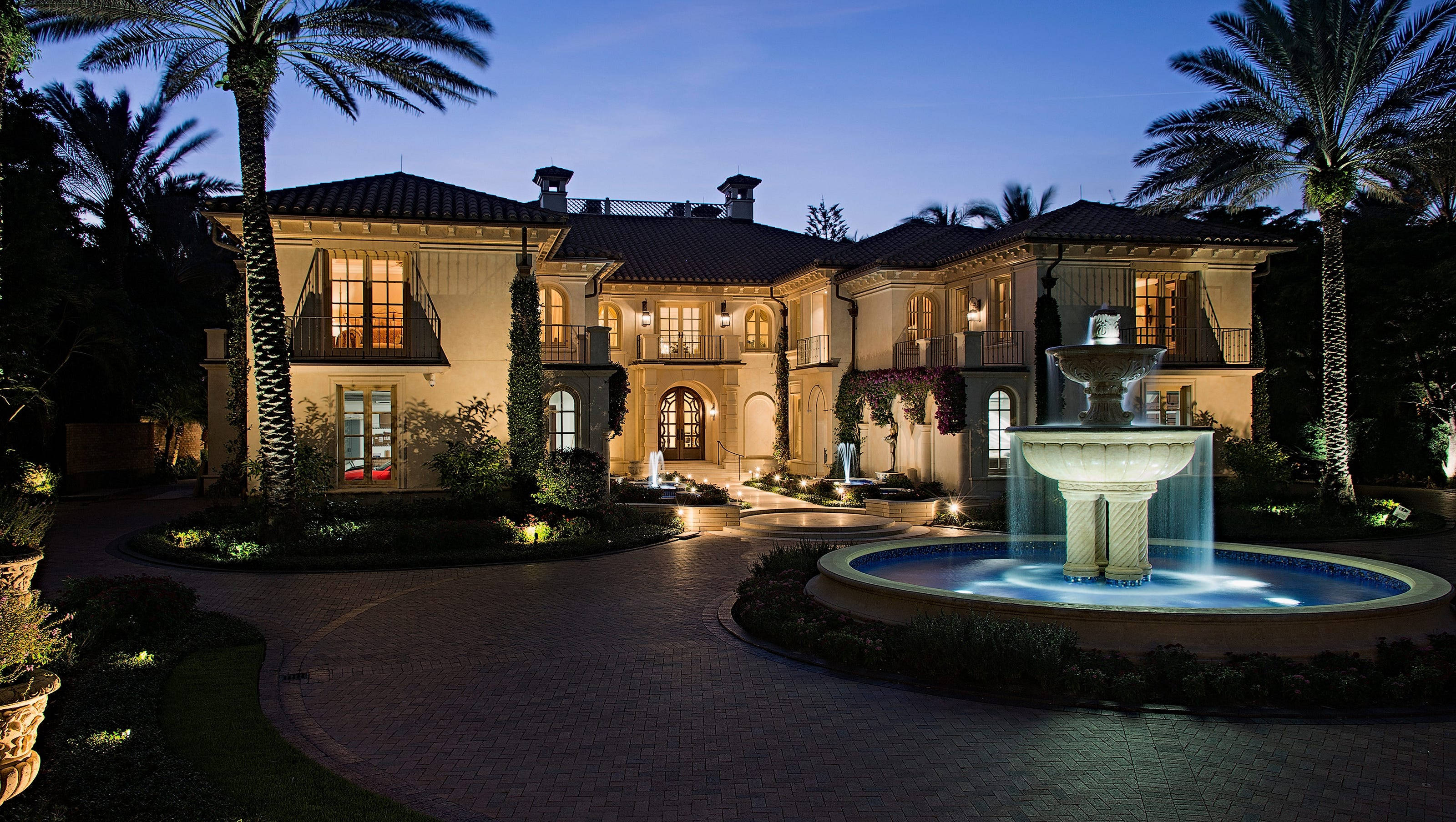 Mediterranean-style mansion, dusk, warm lights, 2K Desktop Wallpaper