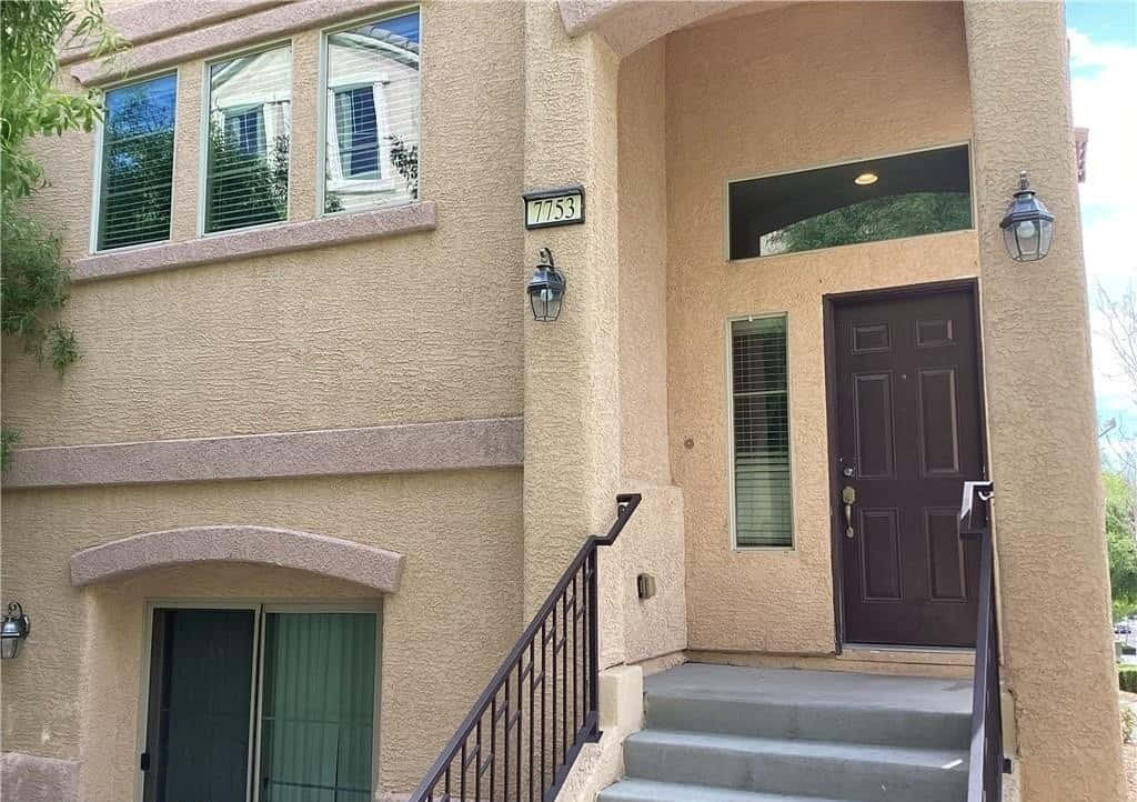7753 Copious Cactus Street, beige stucco, dark wooden door, SD Desktop Wallpaper