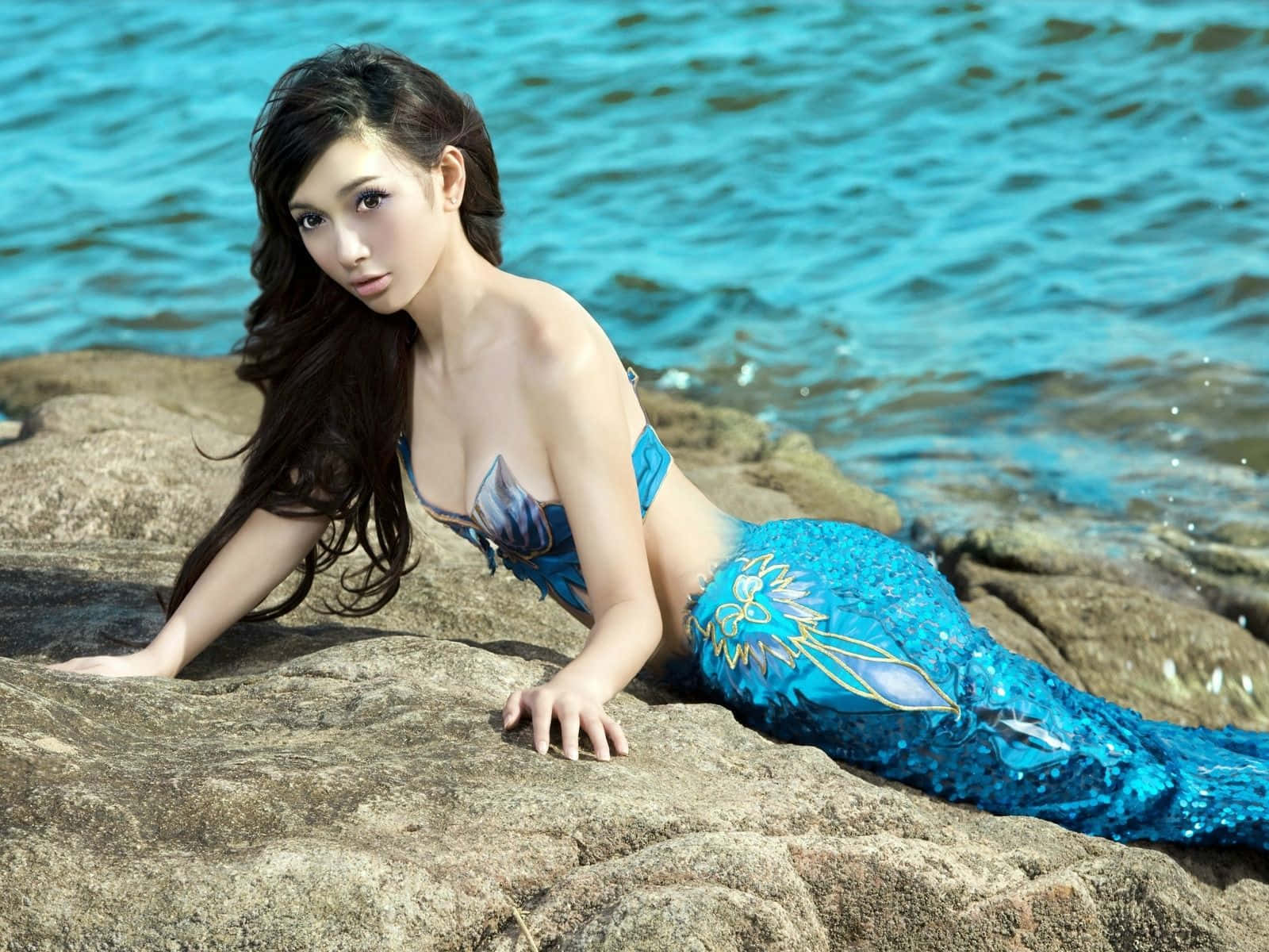 Real Mermaid, shimmering blue mermaid tail, sunlit rocks, HD Desktop Wallpaper