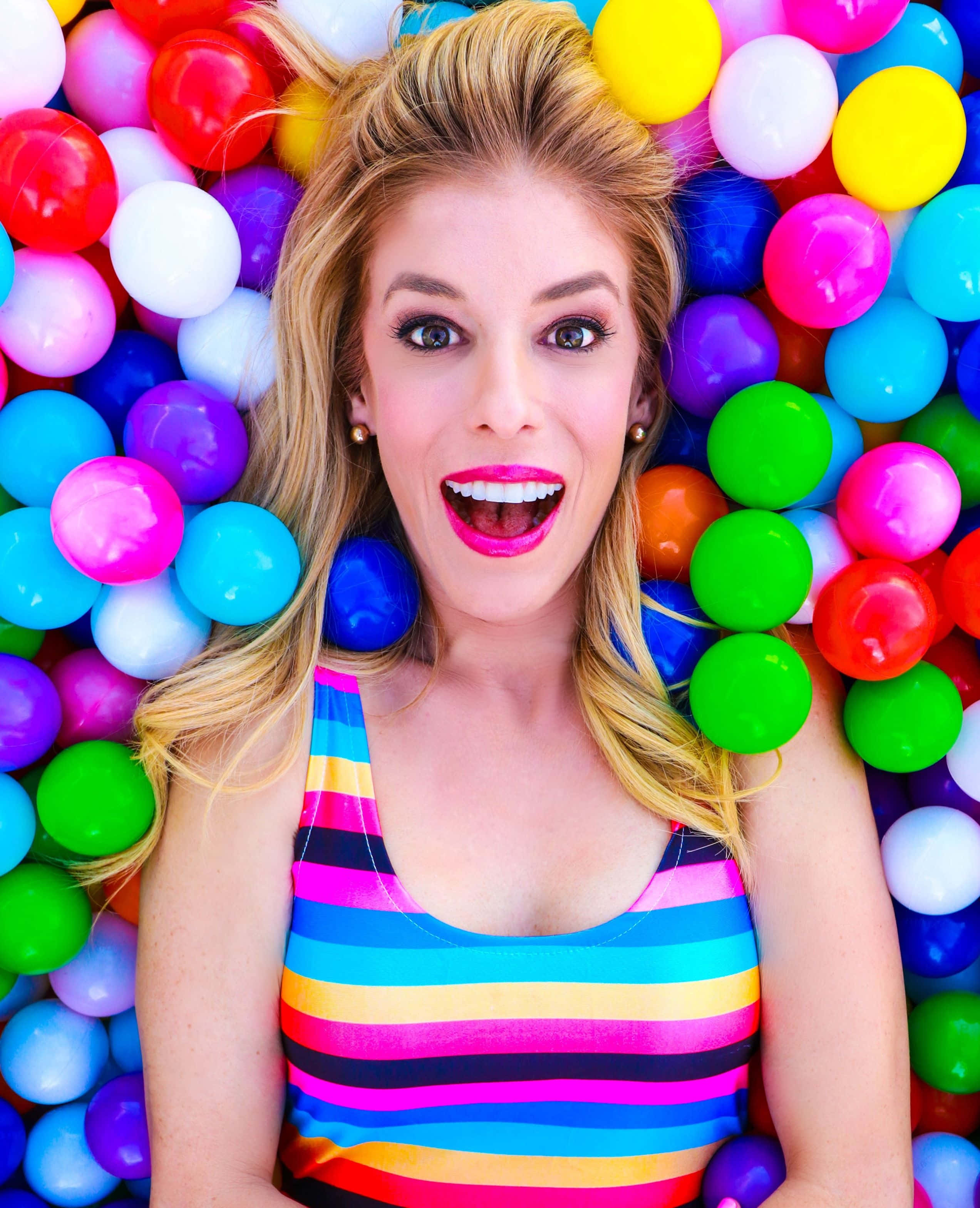 Rebecca Zamolo, bright pink lipstick, sea of colorful plastic balls, 2K Phone Wallpaper