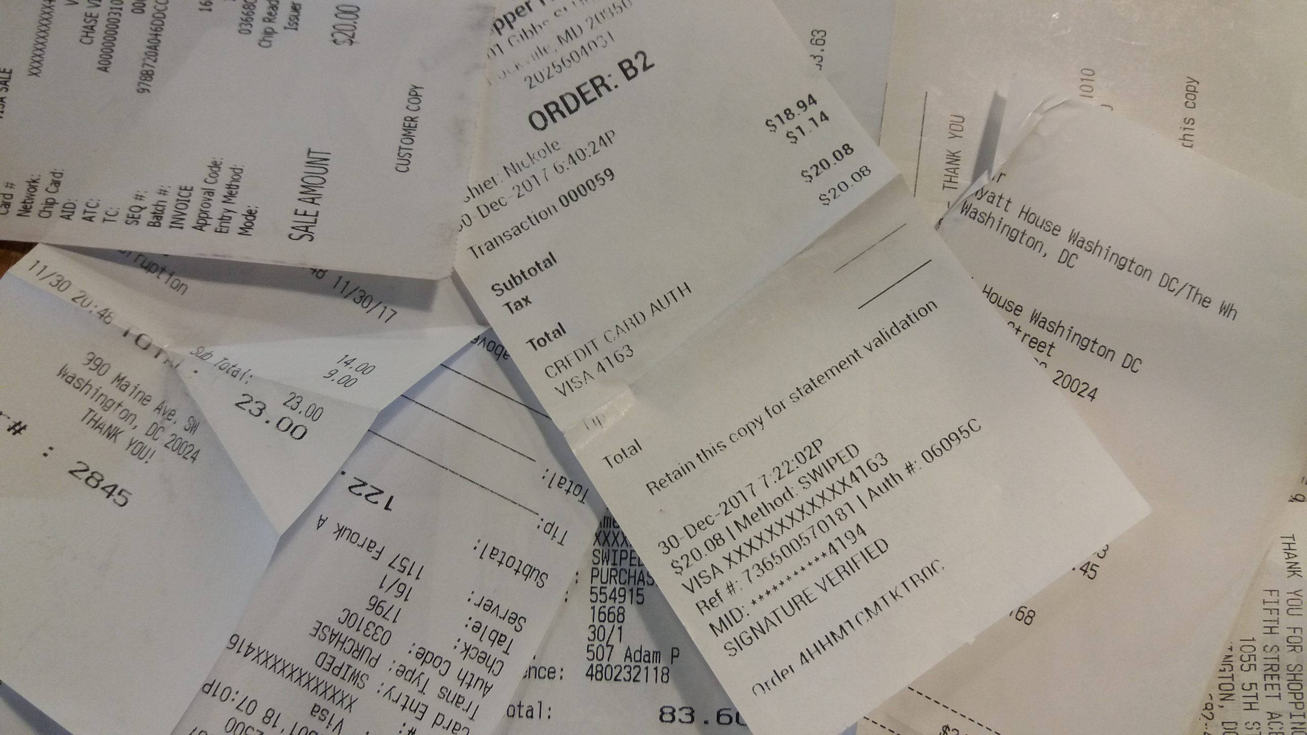 scattered receipt, crumpled restaurant receipts, visible totals, 2K Desktop Wallpaper