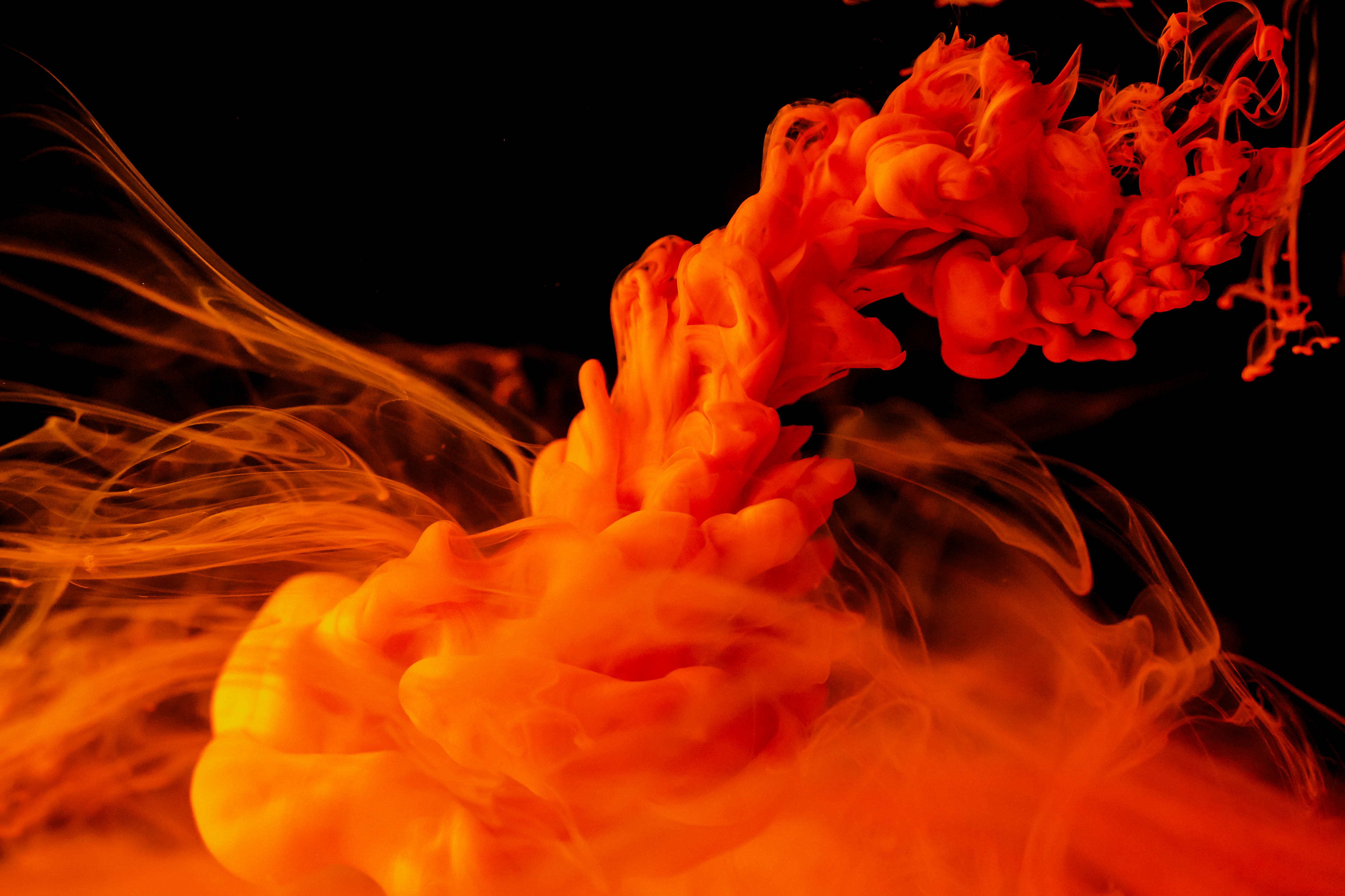 Red Color Ink Explosion, vibrant orange ink swirls, pure black background, 4K Desktop Wallpaper