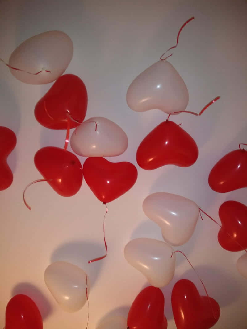 red and white aesthetic, heart-shaped balloons, soft white wall, SD Phone Wallpaper