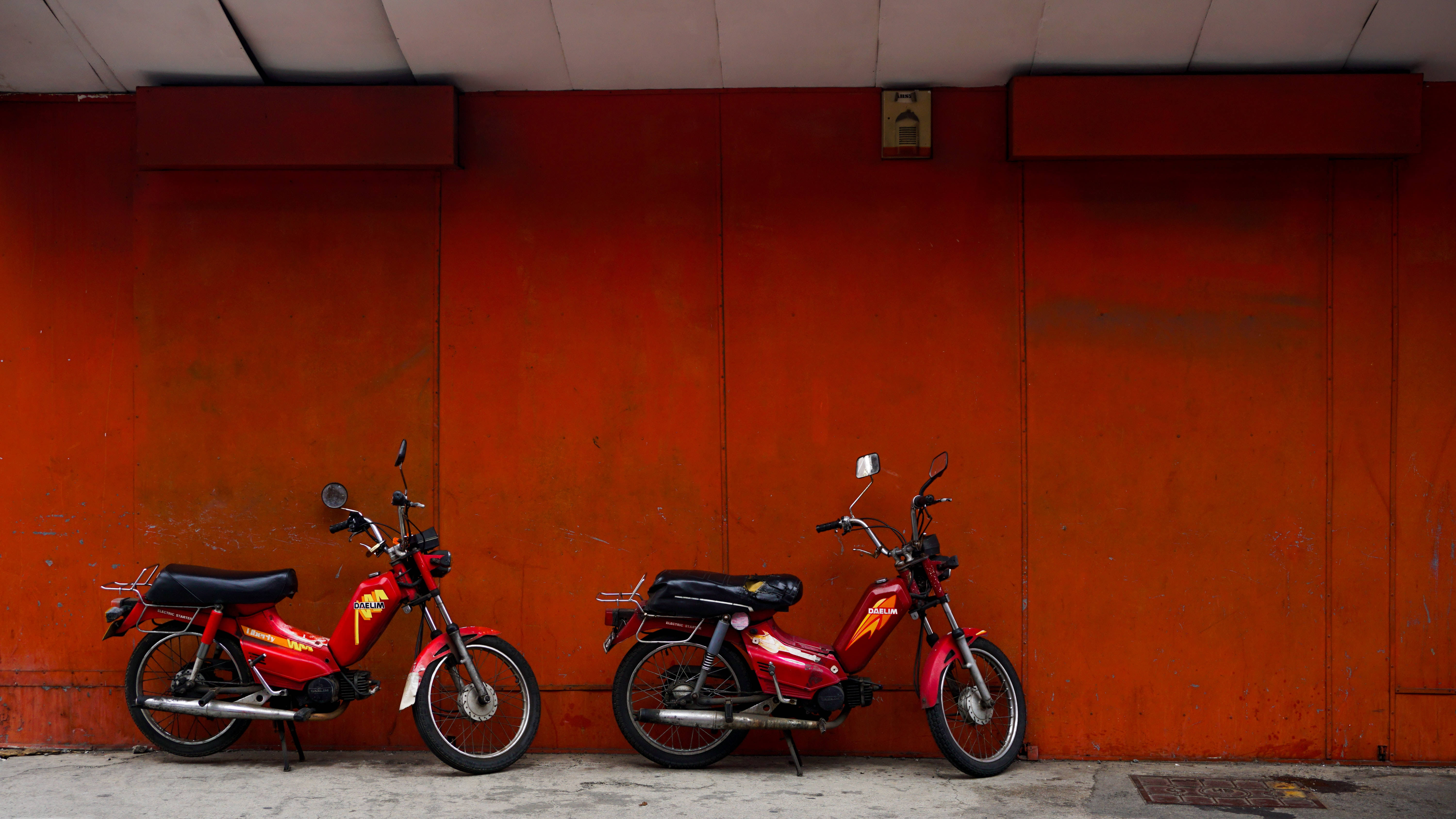 Red Bike, vintage red motorbikes, urban setting, 5K Desktop Wallpaper