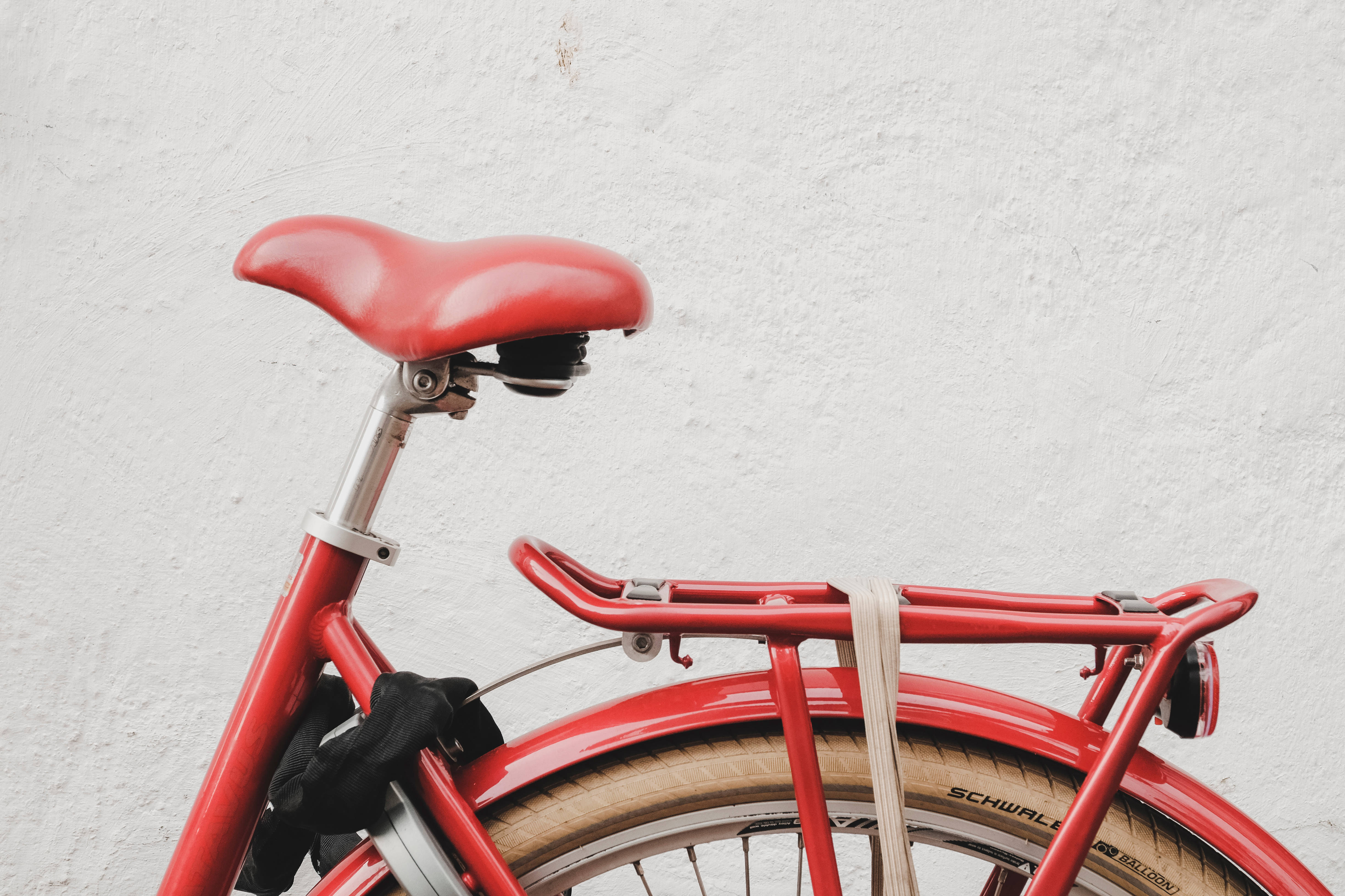 red bike, white wall, vibrant red bicycle, 4K Desktop Wallpaper