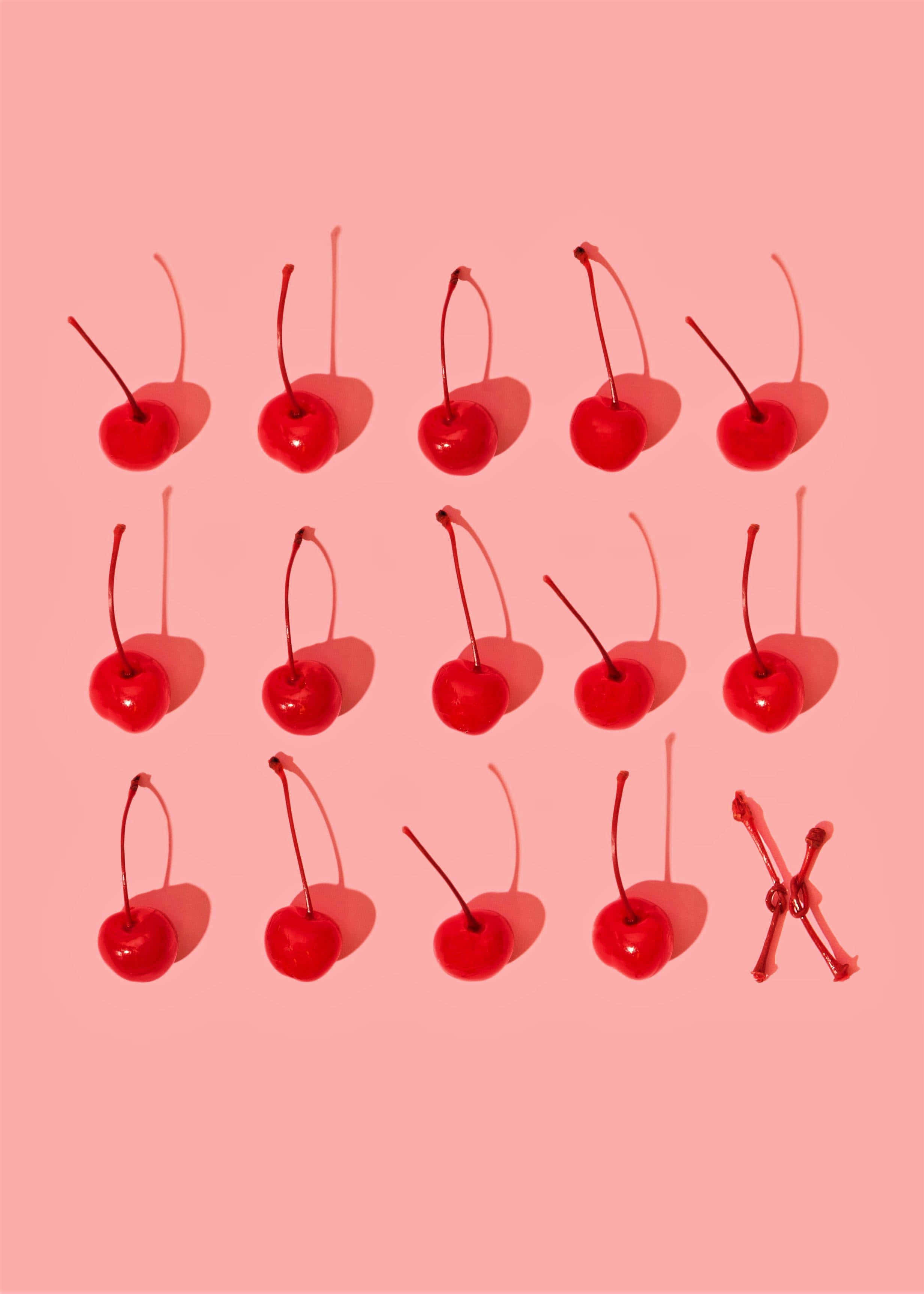 pastel red, fifteen glossy red cherries, soft pink background, 2K Phone Wallpaper