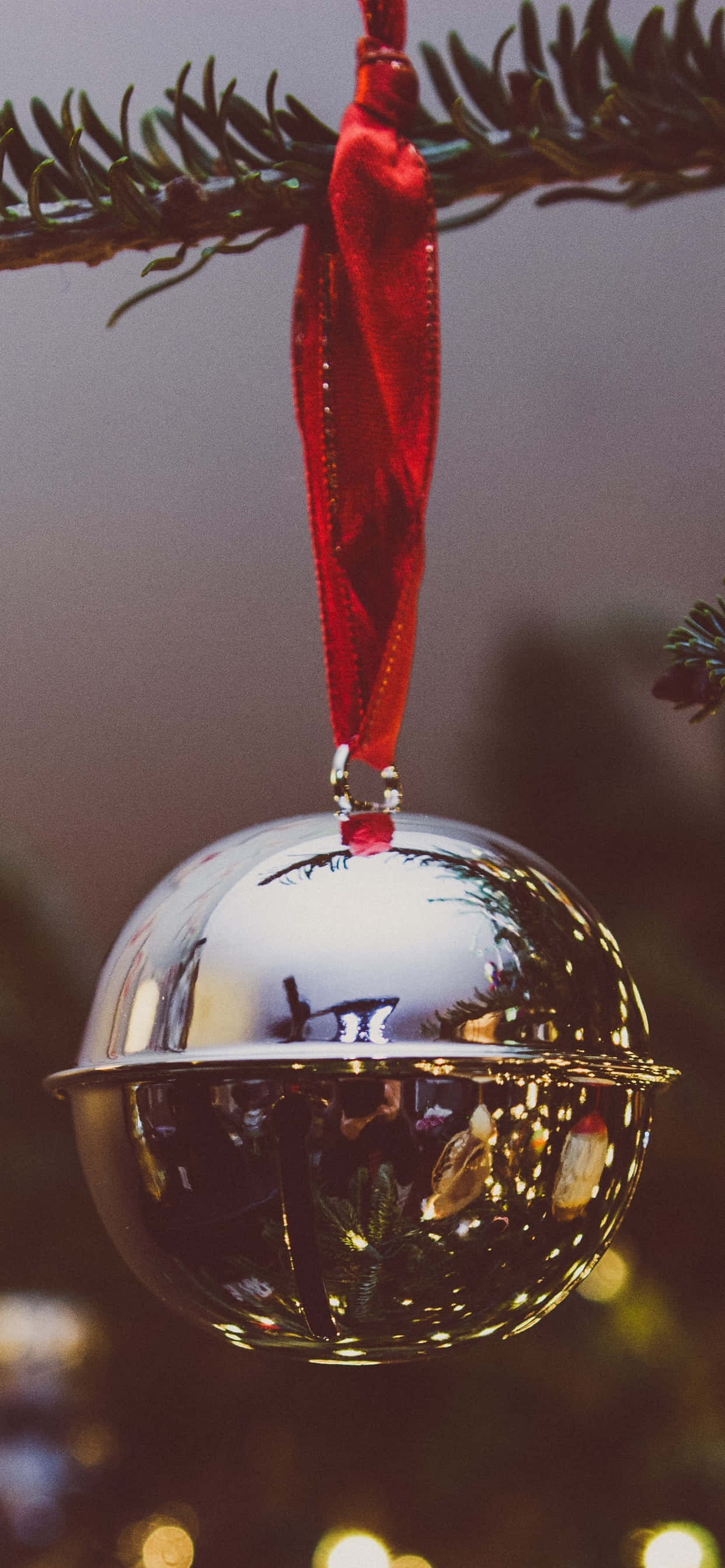 Red Christmas iPhone, silver bell ornament, red ribbon, 2K Phone Wallpaper