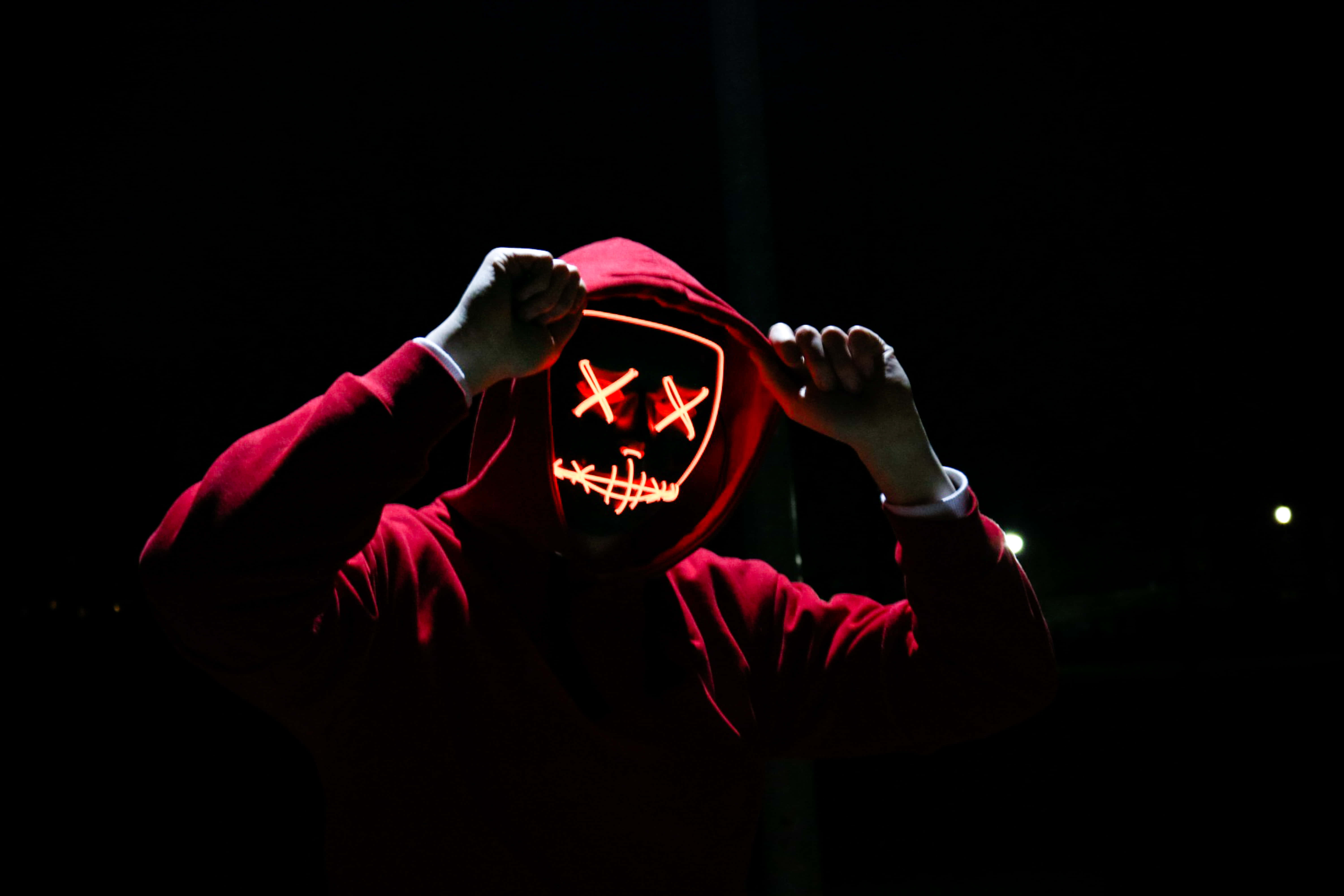 red hoodie, glowing red LED mask, X eyes, 5K Desktop Wallpaper