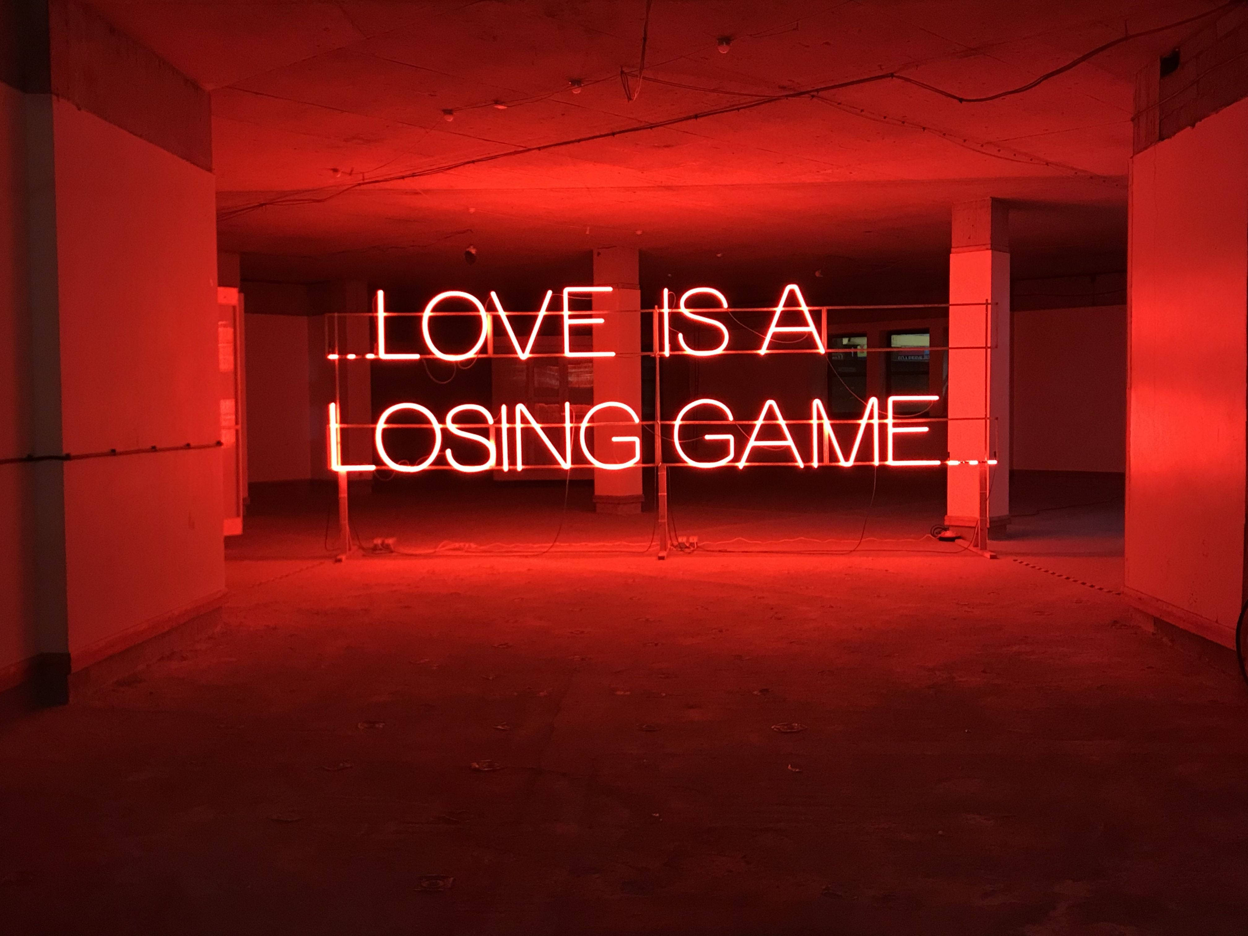 LOVE IS A LOSING GAME, glowing red neon sign, abandoned concrete room, 4K Desktop Wallpaper