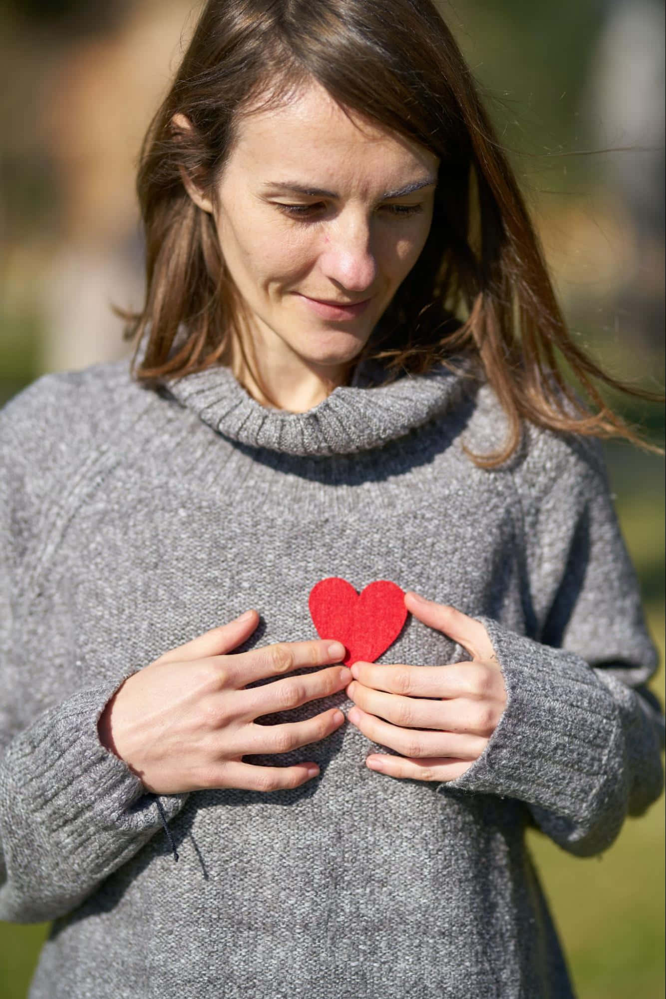 red felt heart, gray sweater, sunlit outdoor setting, Full HD Phone Wallpaper