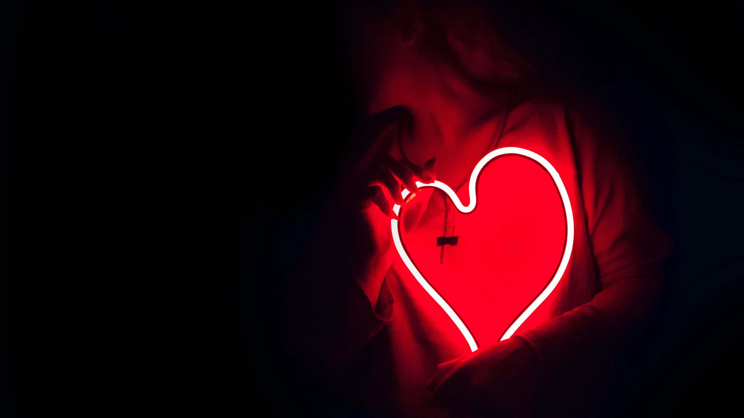 Red Pc, glowing red neon heart, dark background, 2K Desktop Wallpaper