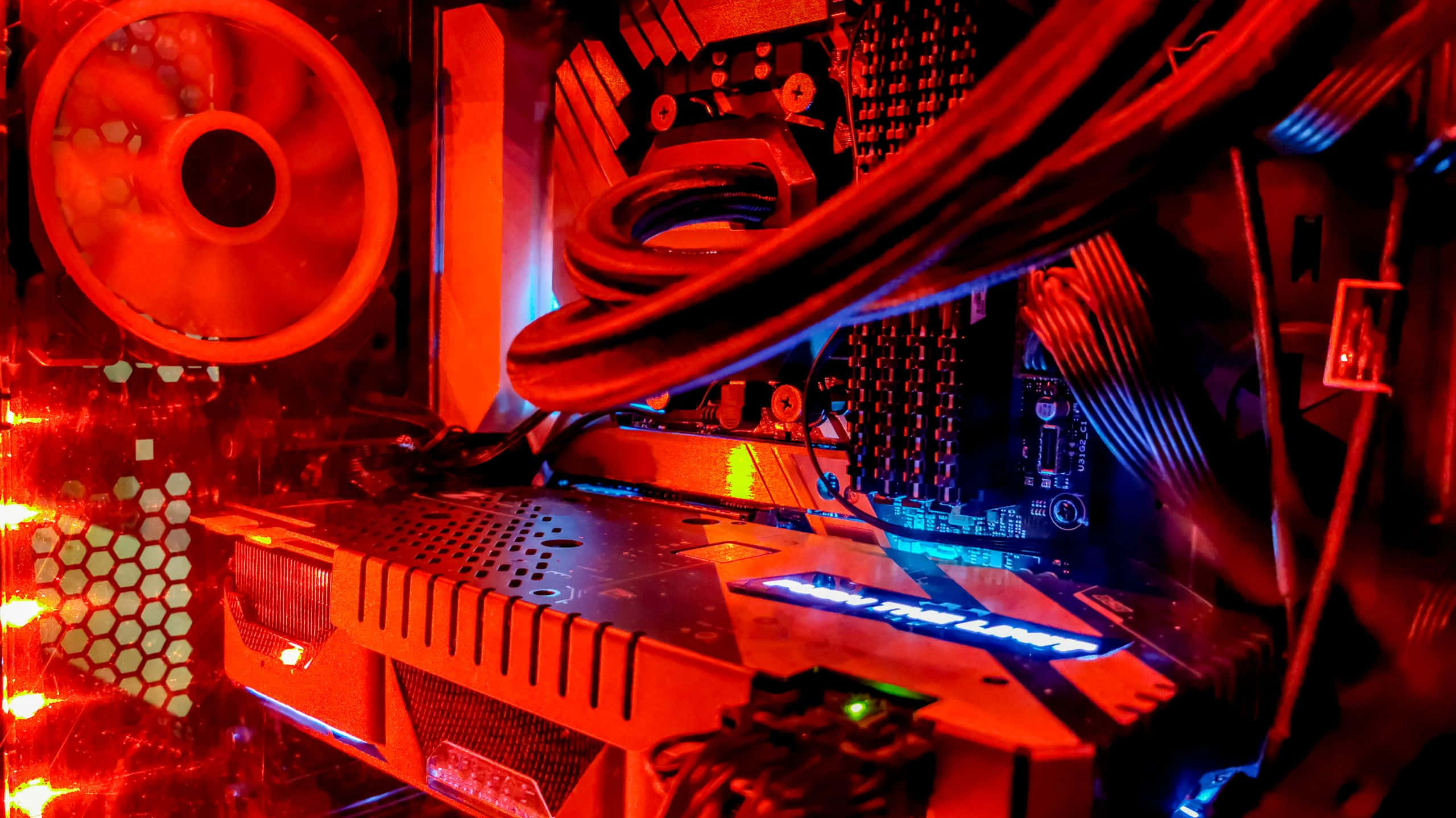 Red Pc, glowing red, blue illuminated, 2K Desktop Wallpaper