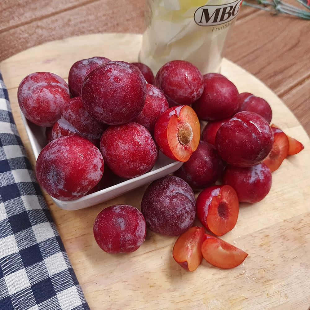 Red Plum, white dish, wooden board, SD Desktop Wallpaper