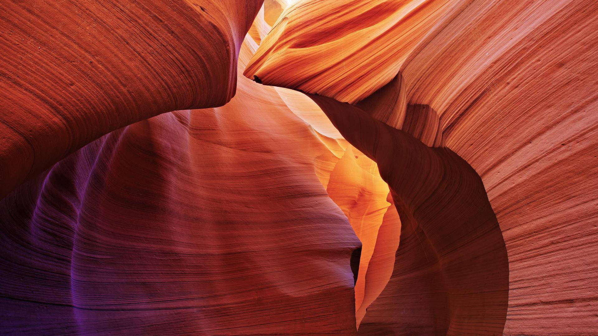textured red rock formation, narrow slot canyon, swirling red orange and purple sandstone walls, Full HD Desktop Wallpaper