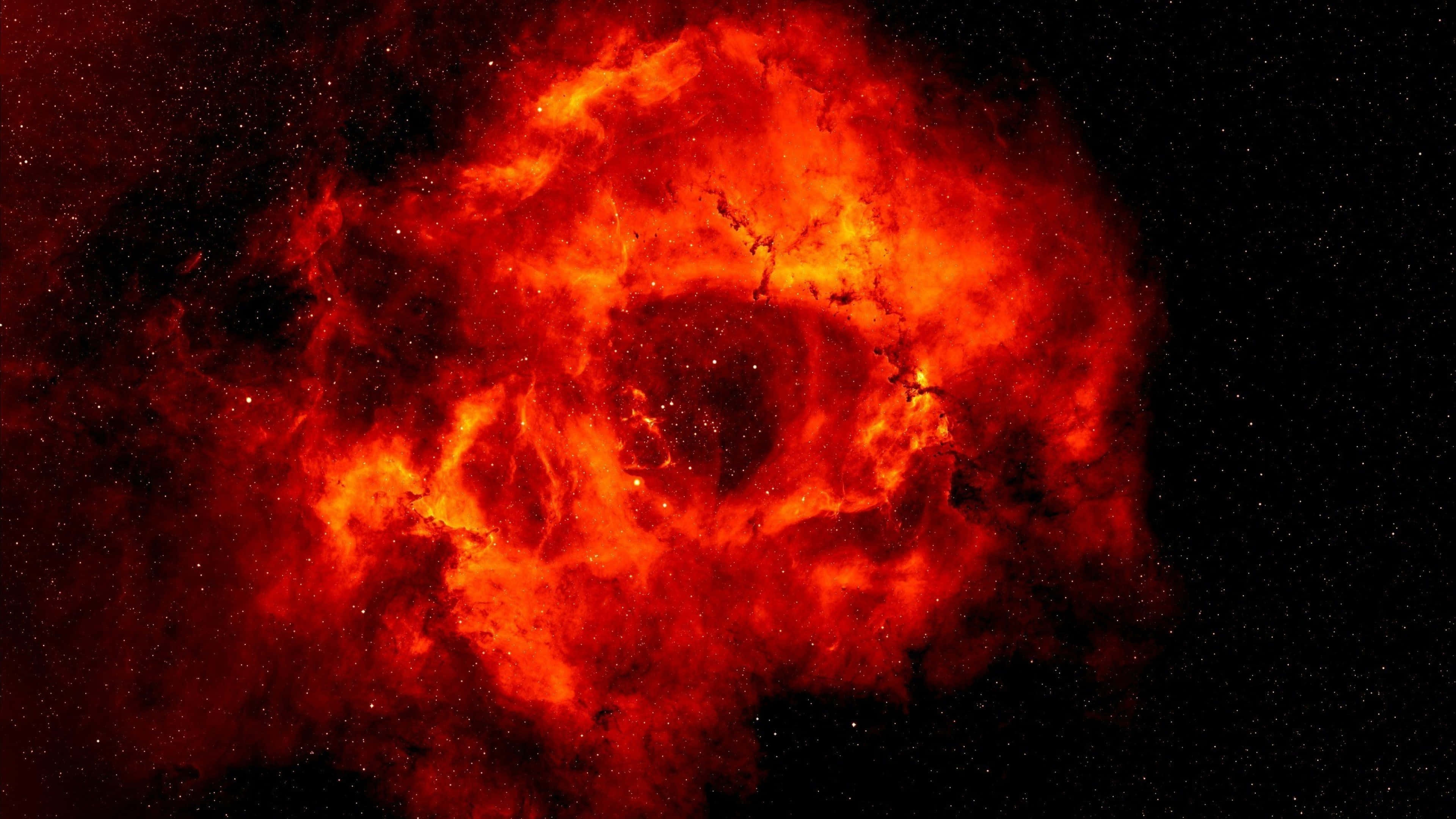 Red Space, fiery red nebula, star-speckled black cosmic void, 4K Desktop Wallpaper